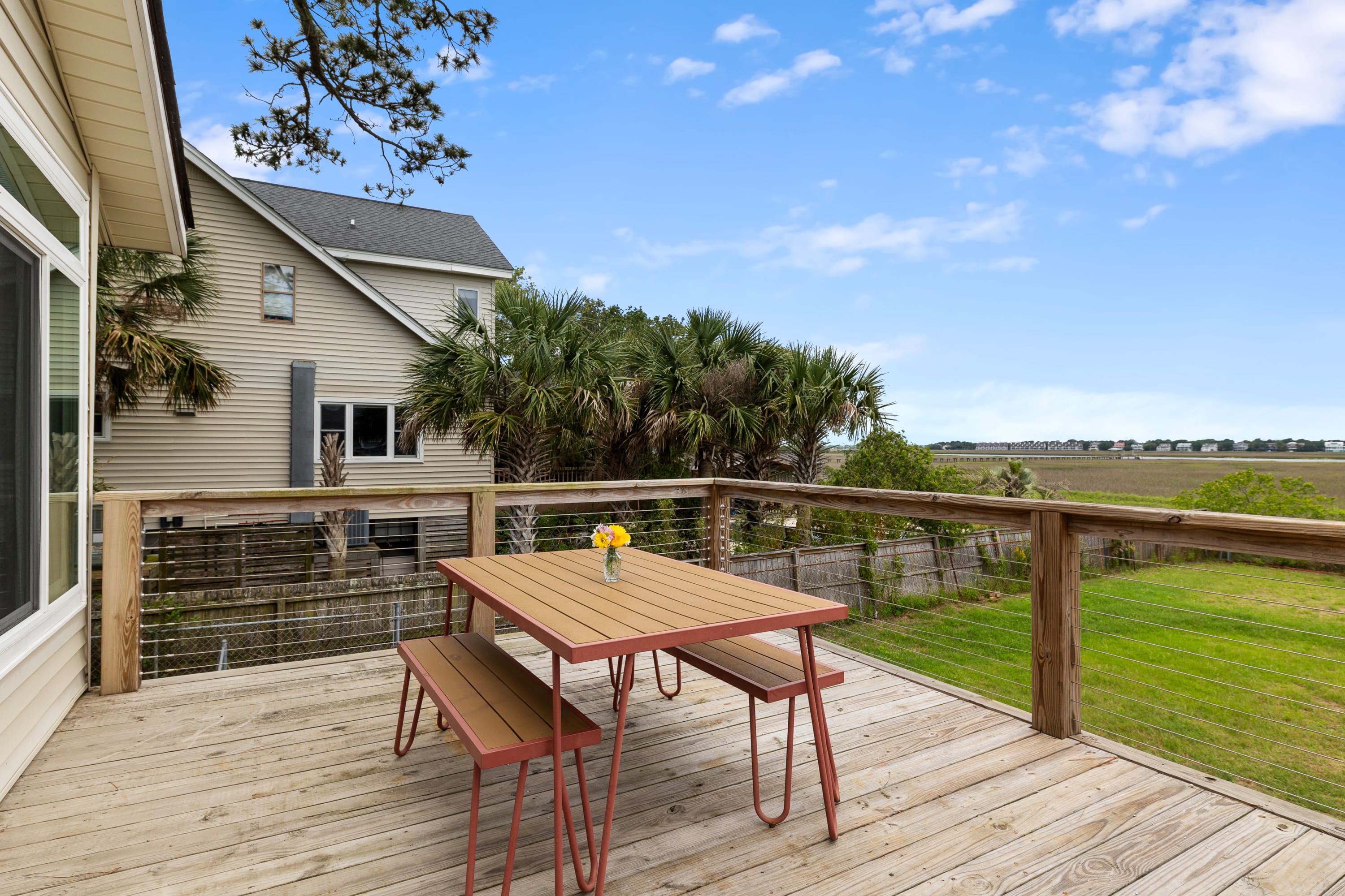 Outdoor dining space with views of Folly Creek!