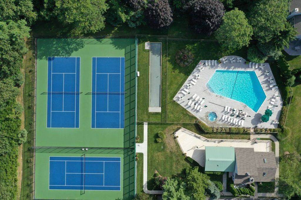 Aerial view of the community's tennis courts and swimming pool.