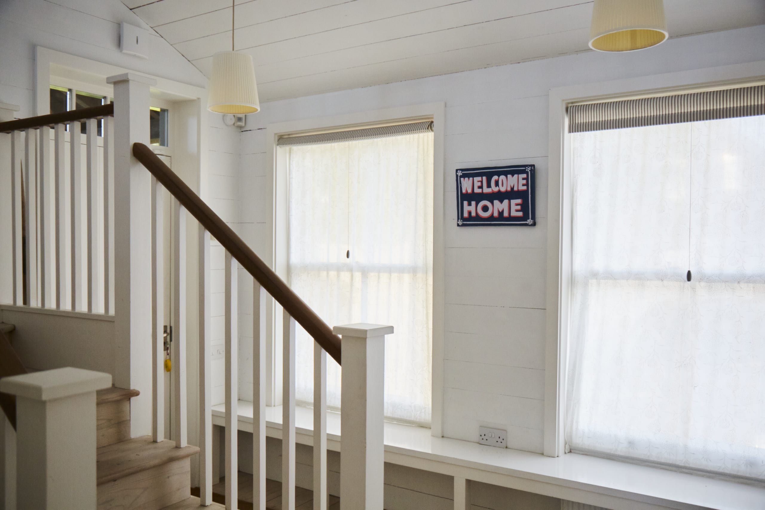 Welcoming entrance hall with stairs leading to the first floor, setting the tone for a great stay