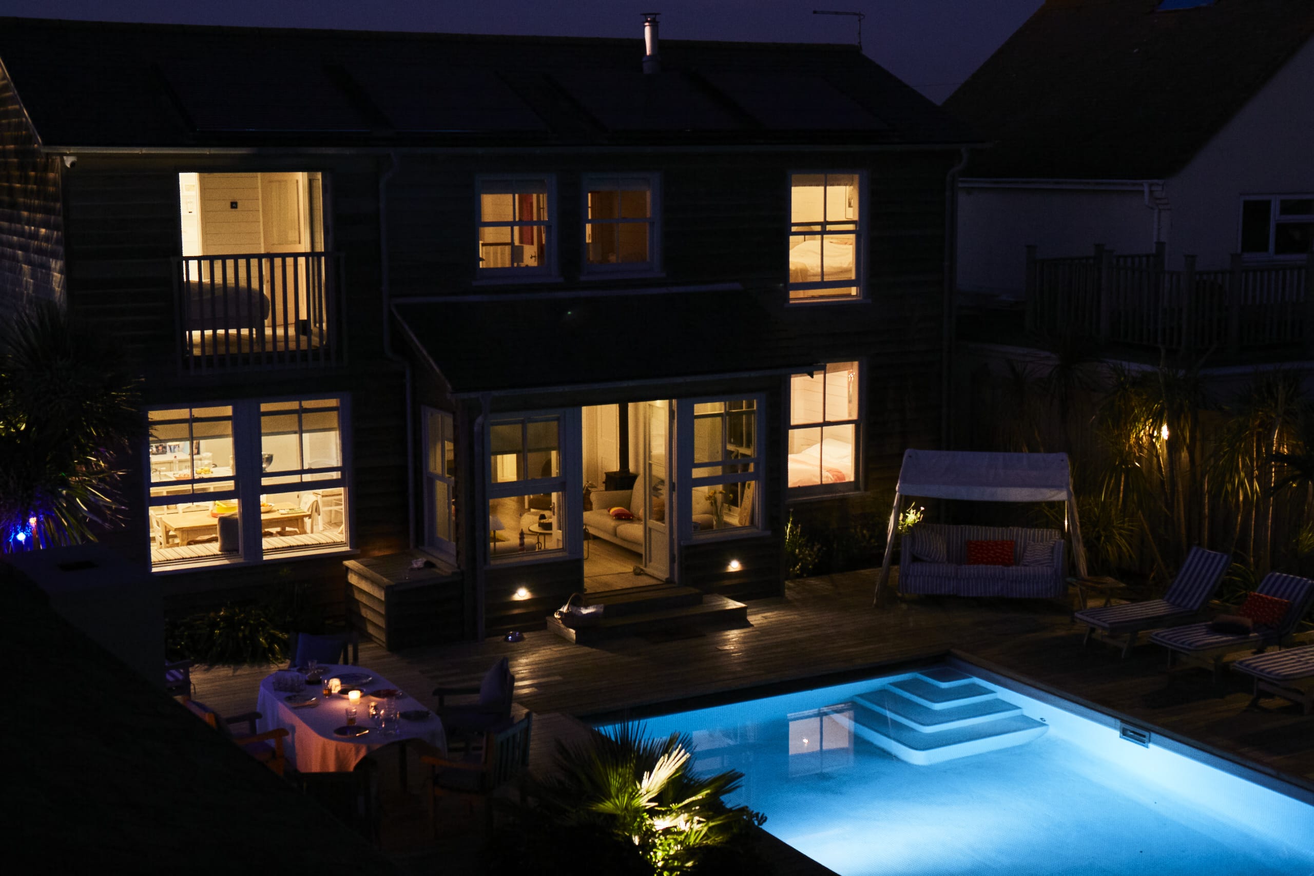 Relax by the pool and enjoy the serene evening ambiance at our stunning seafront property