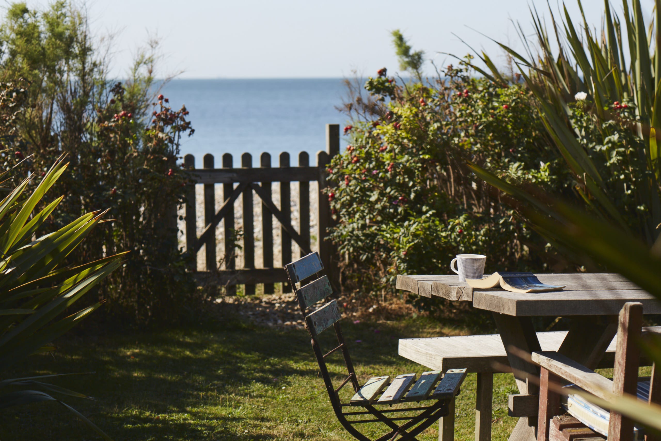 Unwind in our beautiful garden with direct access to the beach, perfect for morning coffee or an afternoon read