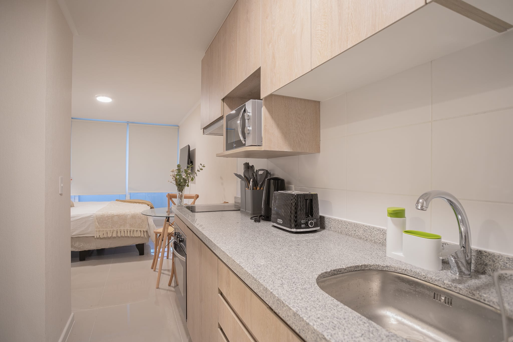 Cozy kitchen with modern amenities, perfect for a couple's retreat in the heart of the city.