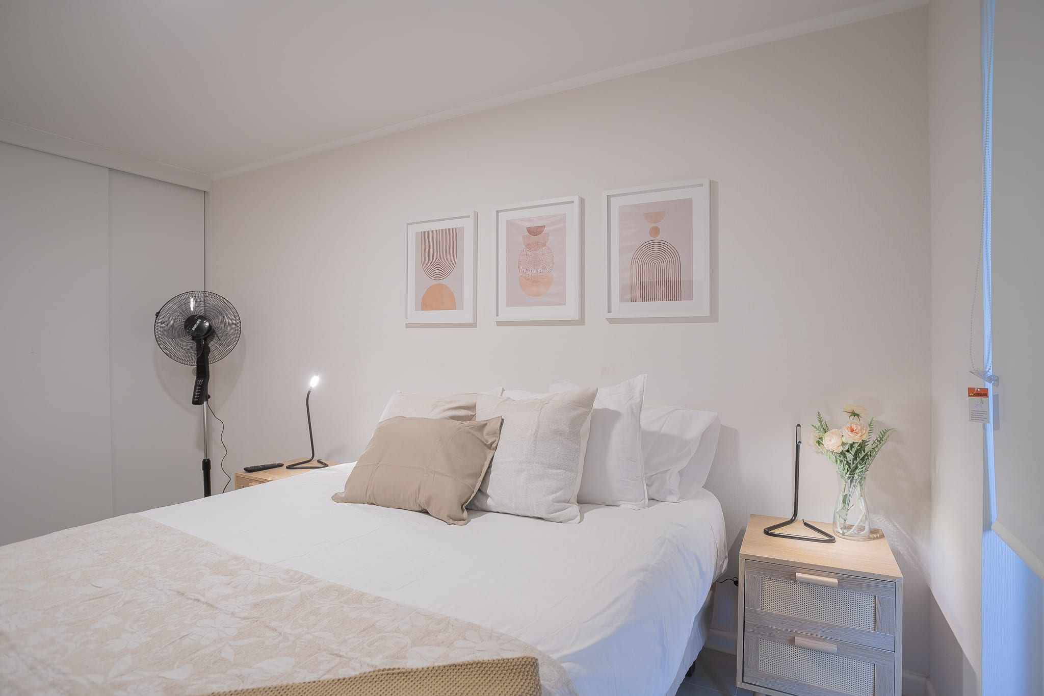 Relax in this modern studio with a cozy double bed, stylish decor, and ambient lighting for a restful stay.