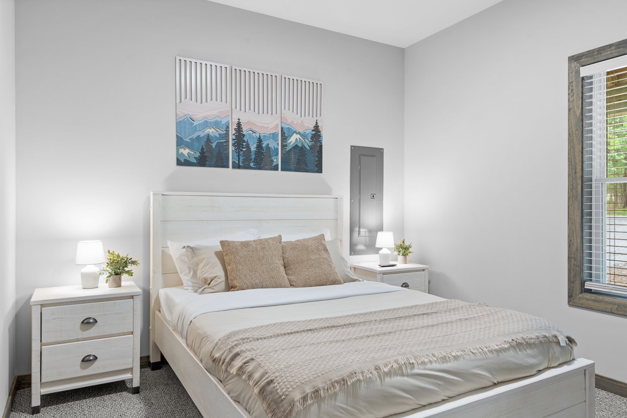 Clean, serene, and inviting. This main bedroom has soft natural light and a calming palette that makes for an effortless night’s sleep.