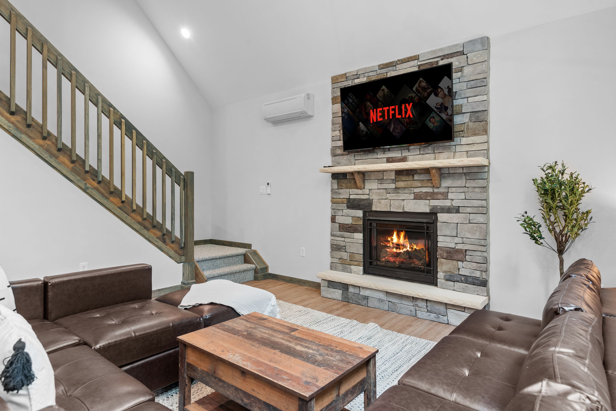 Living Room with Fireplace View
This spacious living room invites you to relax with a cozy fireplace, a big-screen TV, and plenty of room to spread out.