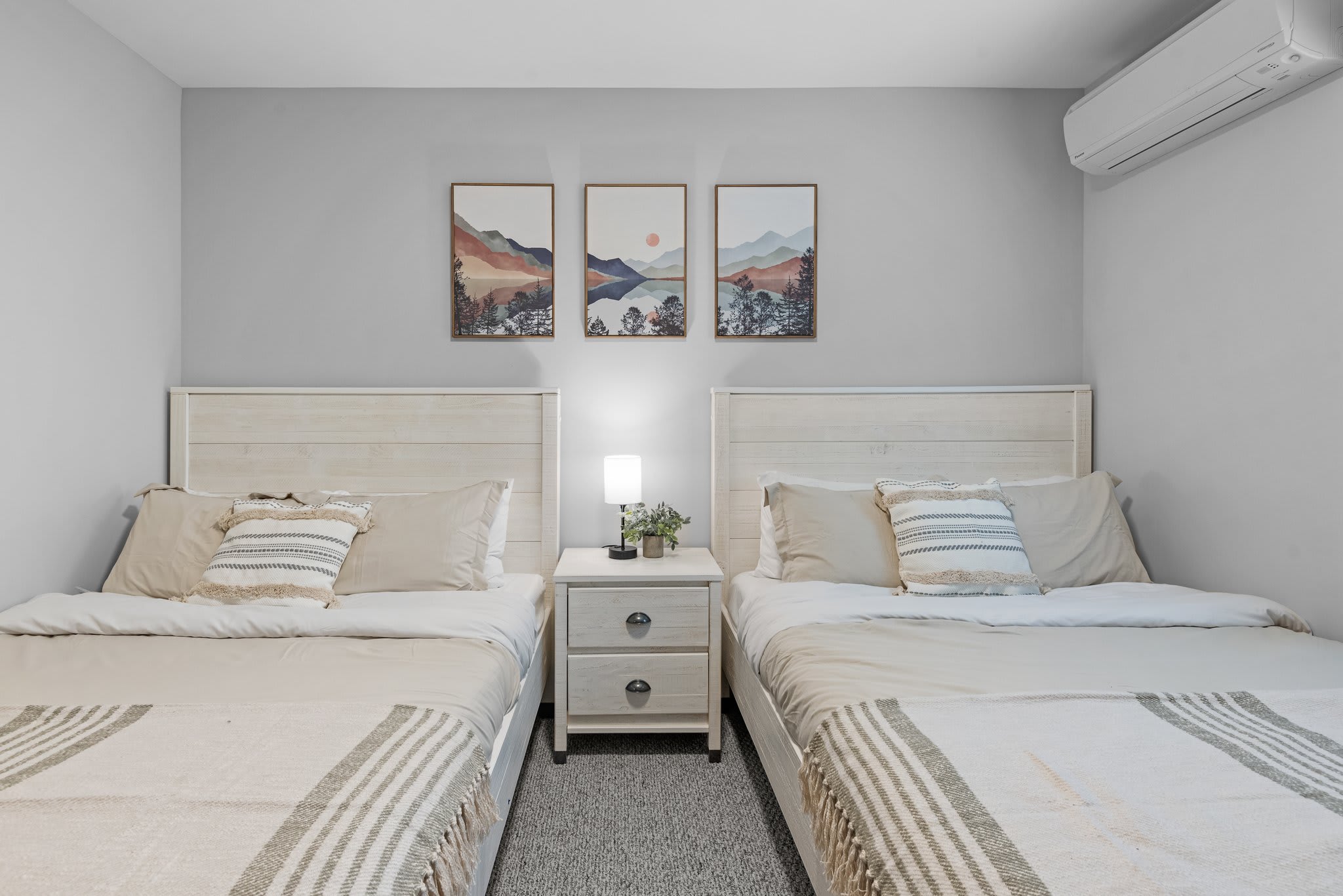 This angle highlights the symmetry and cozy touches that make this setup feel extra welcoming.