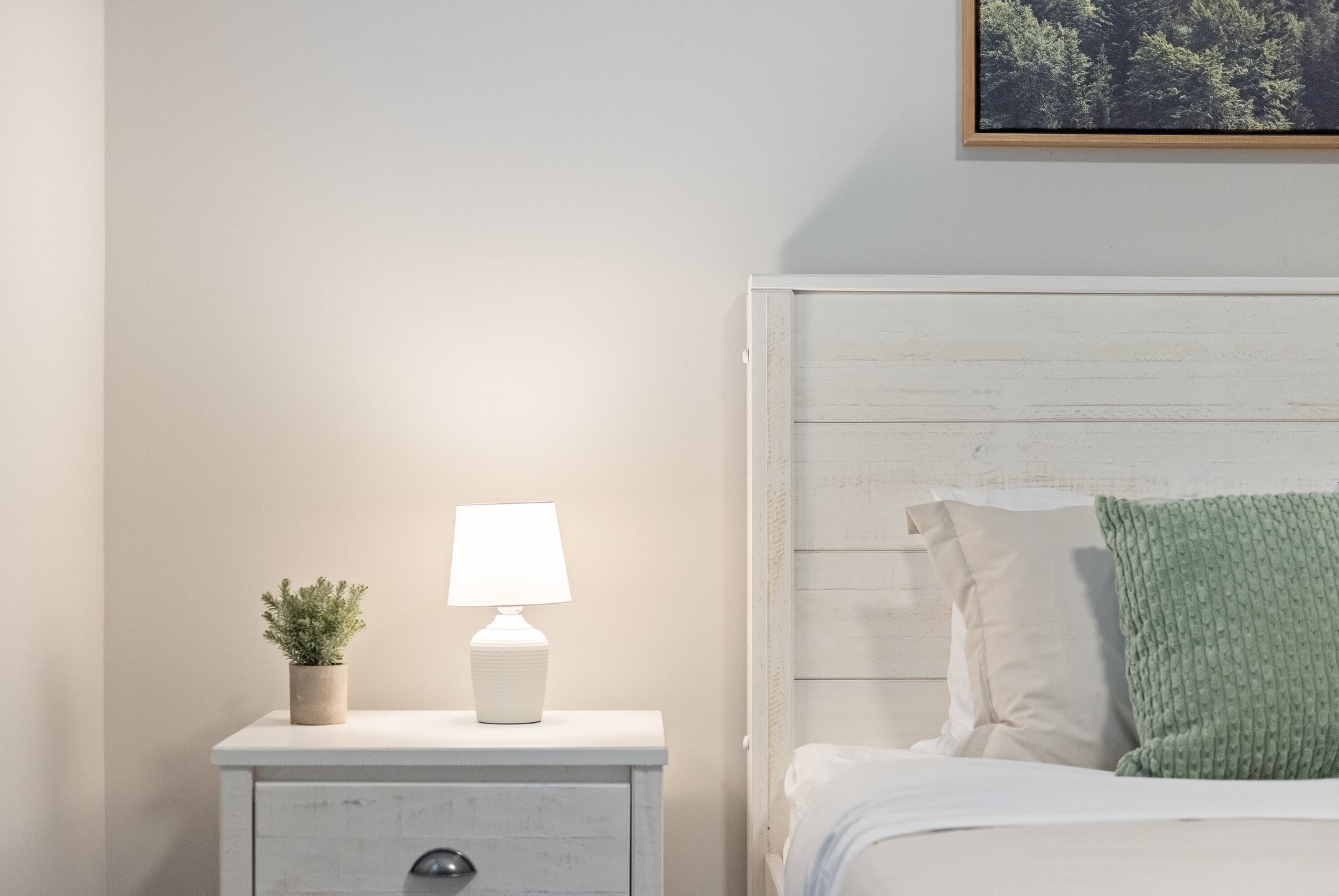 Center-framed with a warm, neutral palette and cozy lighting. A simple and serene place to recharge.