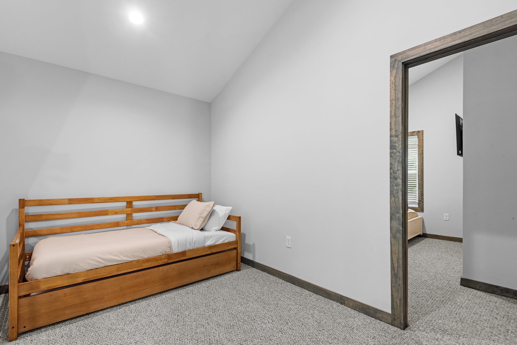 Tucked in and comfy, this daybed setup is ideal for extra guests or kids. Simple and versatile with a homey feel.