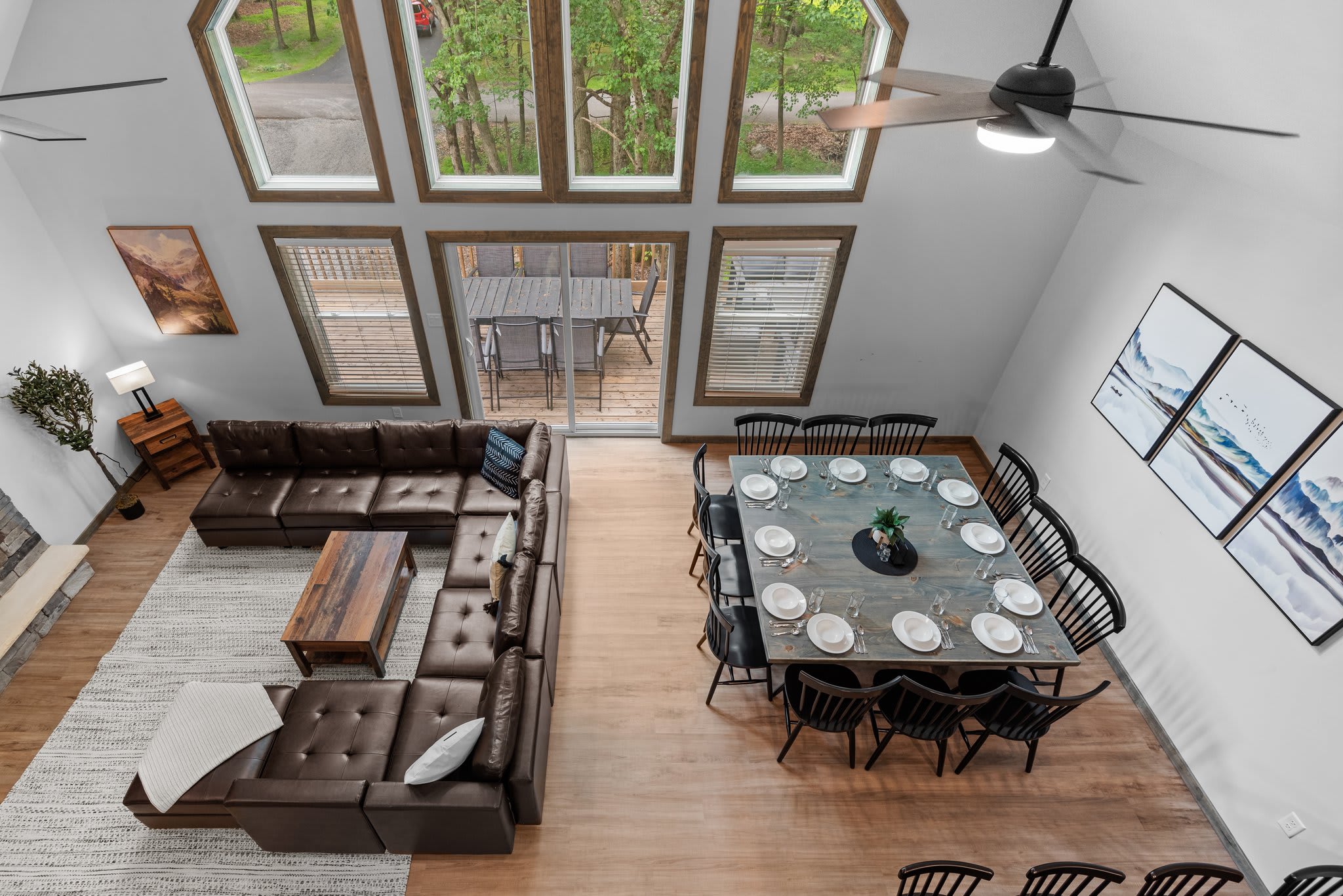 Bird’s Eye View of Main Area
A stunning look from above shows off the open floor plan, tall windows, and seamless flow between living, dining, and kitchen.
