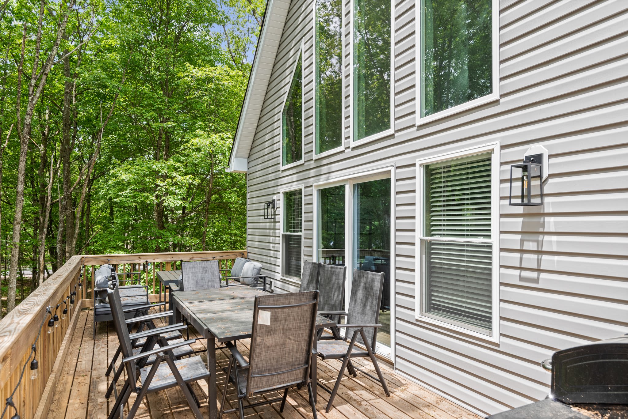Back Deck View of the House
Surrounded by trees, the outdoor dining setup along the back of the house is perfect for grilling, lounging, or taking in the peace and quiet.