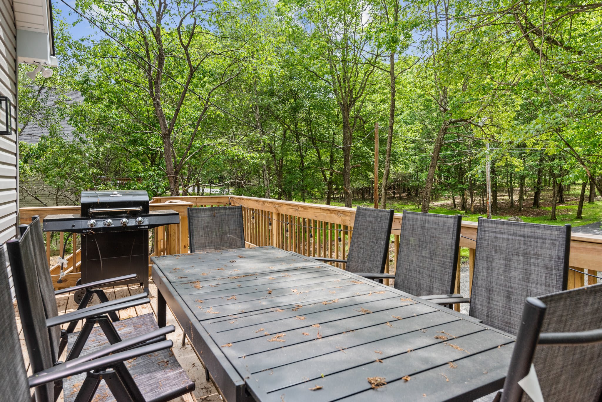 Dine under the trees with a grill going and good company all around. This peaceful deck is made for slow mornings and long evenings.