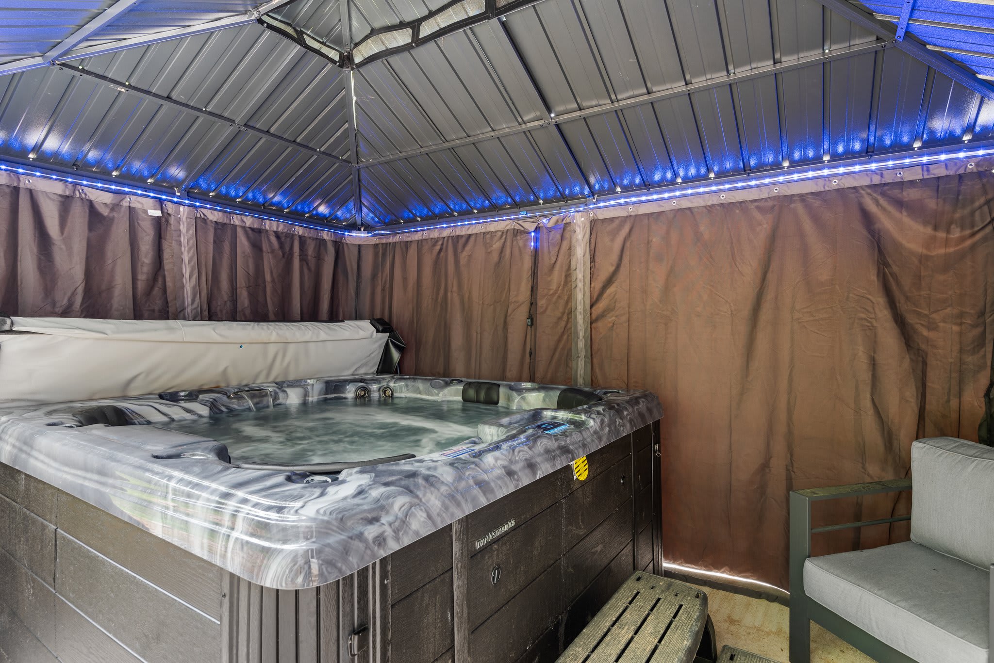 A second look at the hot tub setup shows ample space to lounge and unwind, all sheltered for year-round comfort.