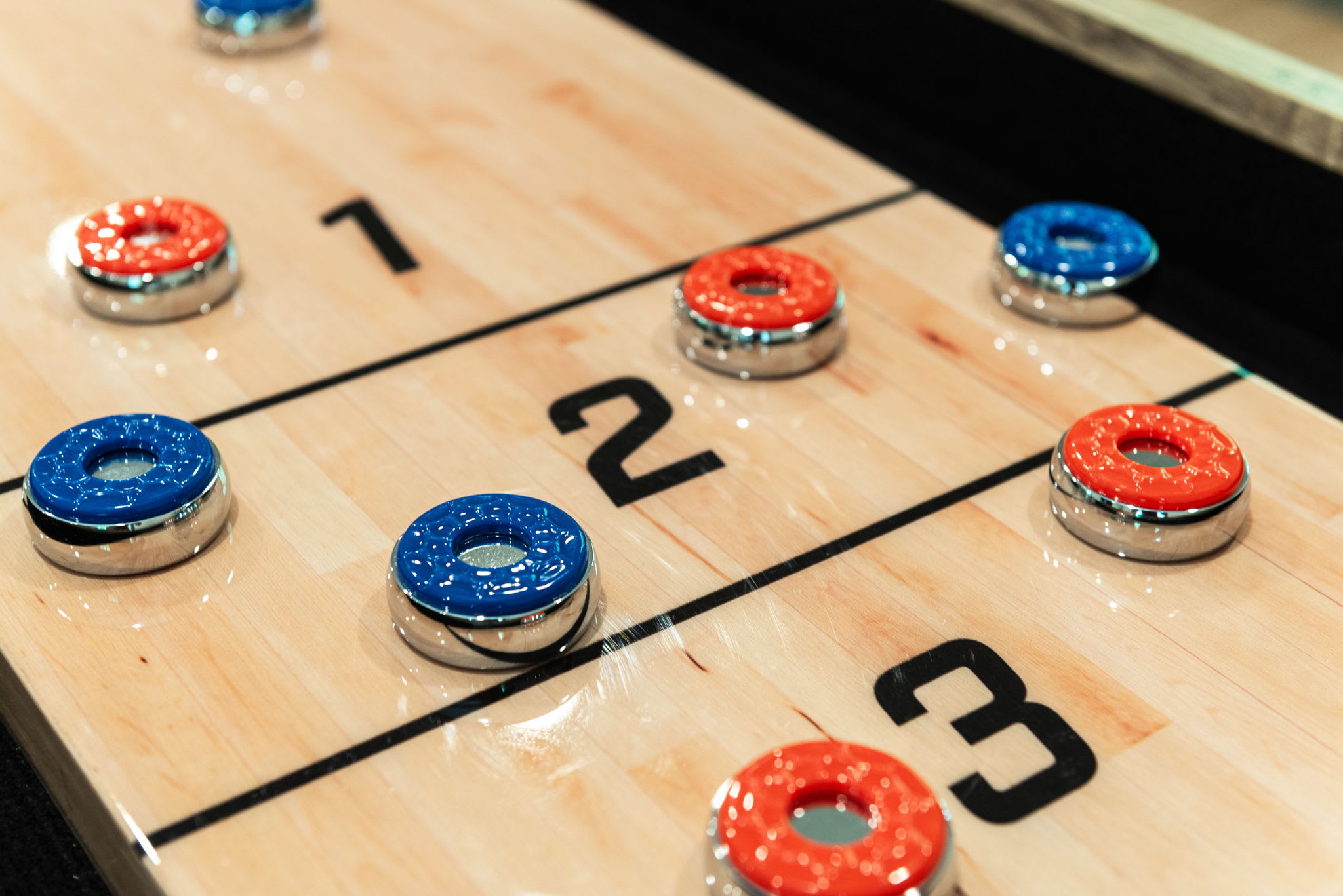 Shuffleboard Close-Up
Game on. This close-up brings out the fun, showing off the smooth surface and game-ready pucks.