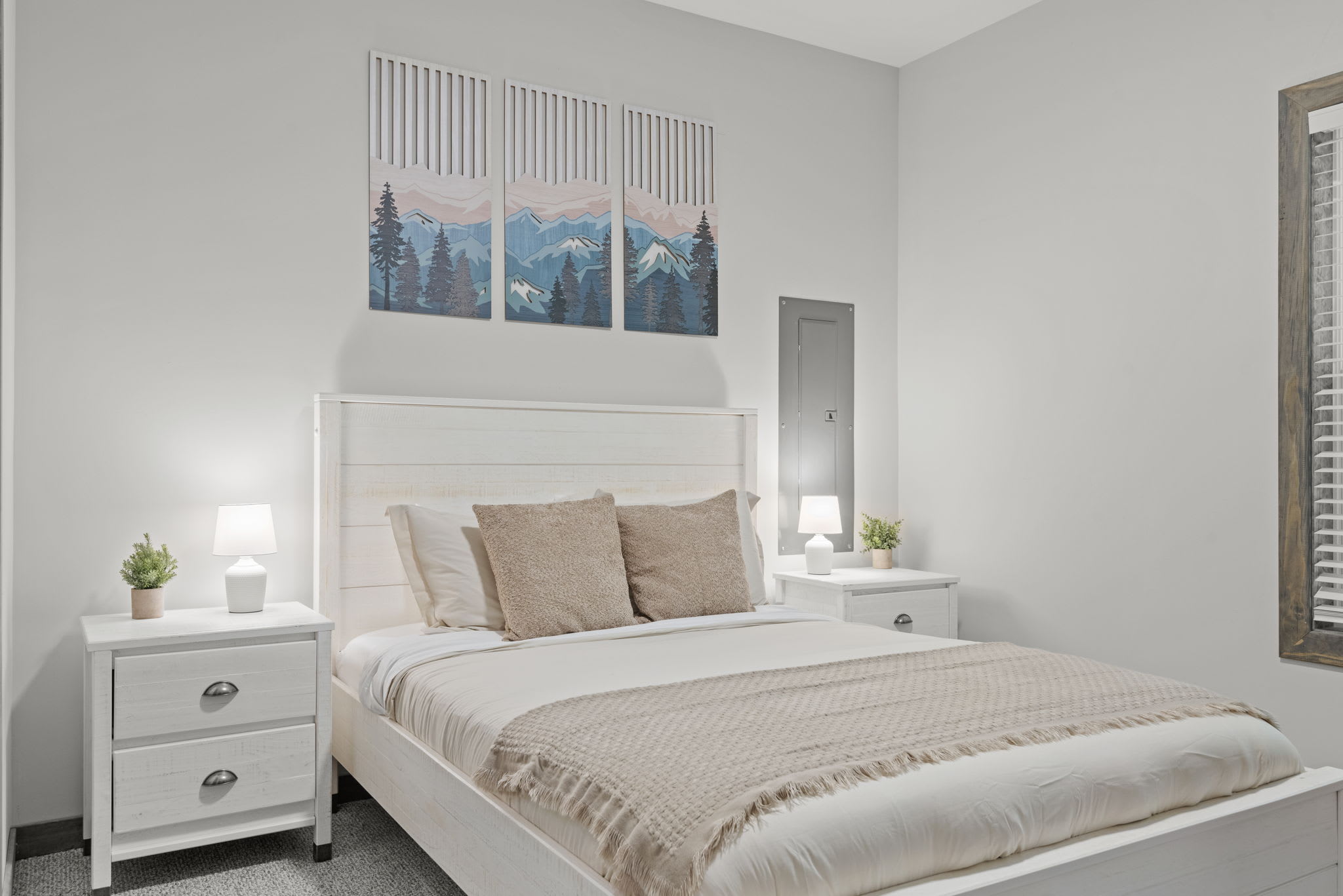 Simple and soothing. A queen bed, soft lighting, and nature-inspired art make this a comfy place to recharge.