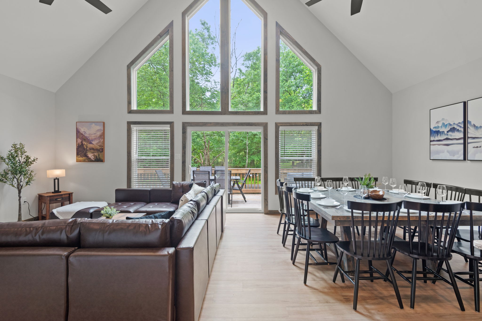 Full Living and Dining View
Soaring ceilings and tall windows flood the space with light, giving the open-concept living and dining area a spacious, inviting vibe.