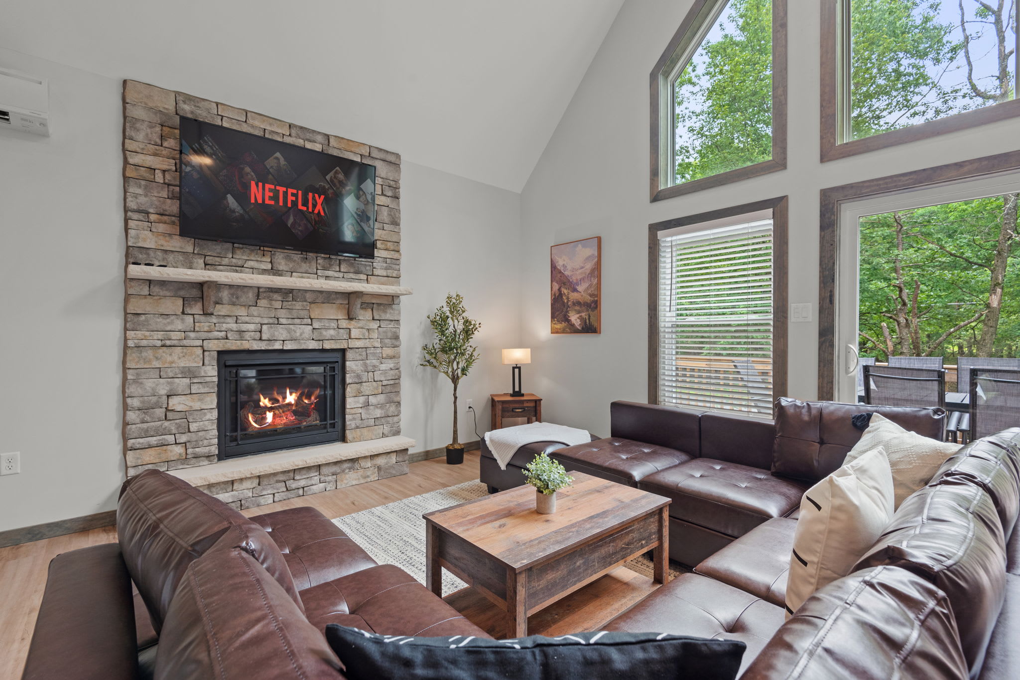 Living Room with Fireplace & Netflix
A cozy central hangout spot with a stone fireplace, large sectional, and a mounted TV for movie nights or lazy afternoons.