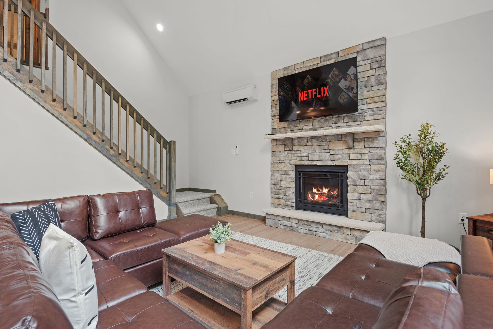 Living Room with Fireplace and TV
The perfect central hub. With a stone fireplace, mounted TV, and plenty of seating, this living room is built for comfort and connection.