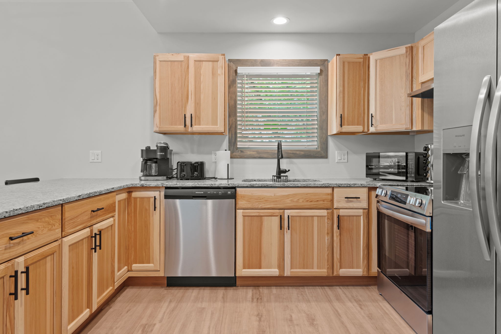 Kitchen with Stainless Appliances
Fully stocked and ready to go. Modern appliances, warm wood cabinetry, and lots of counter space make this kitchen both functional and homey.