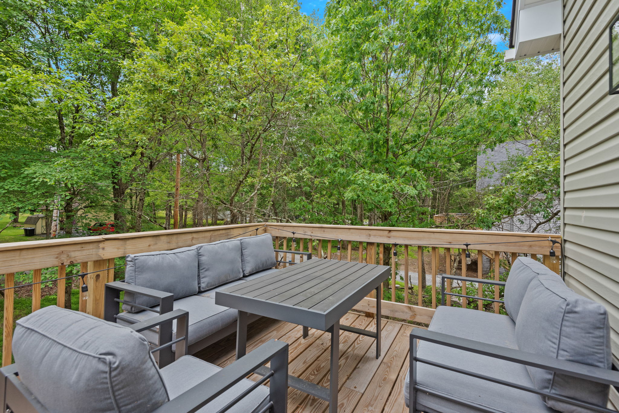 Cozy Lounge Seating on Deck
This outdoor nook is great for laid-back conversations, morning coffee, or enjoying the peaceful wooded view.
