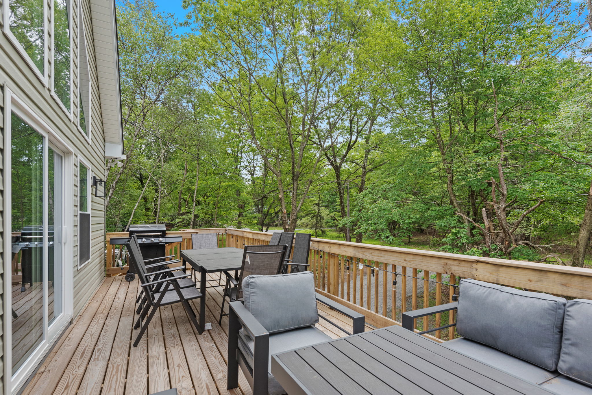 Full Deck with Forest View
Surrounded by nature, this extended deck offers plenty of seating and a quiet escape with forest views in every direction.
