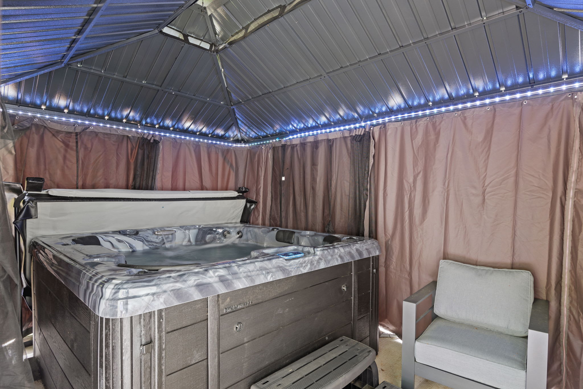 Covered Hot Tub with Lounge Chairs
Private and peaceful, the hot tub setup includes soft lighting and comfortable seating to complete your personal outdoor spa experience.