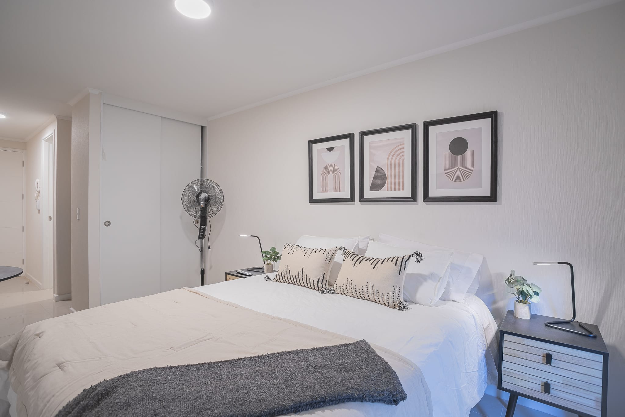 Relax in this stylish studio featuring cozy bedding, modern decor, and a serene ambiance perfect for unwinding.