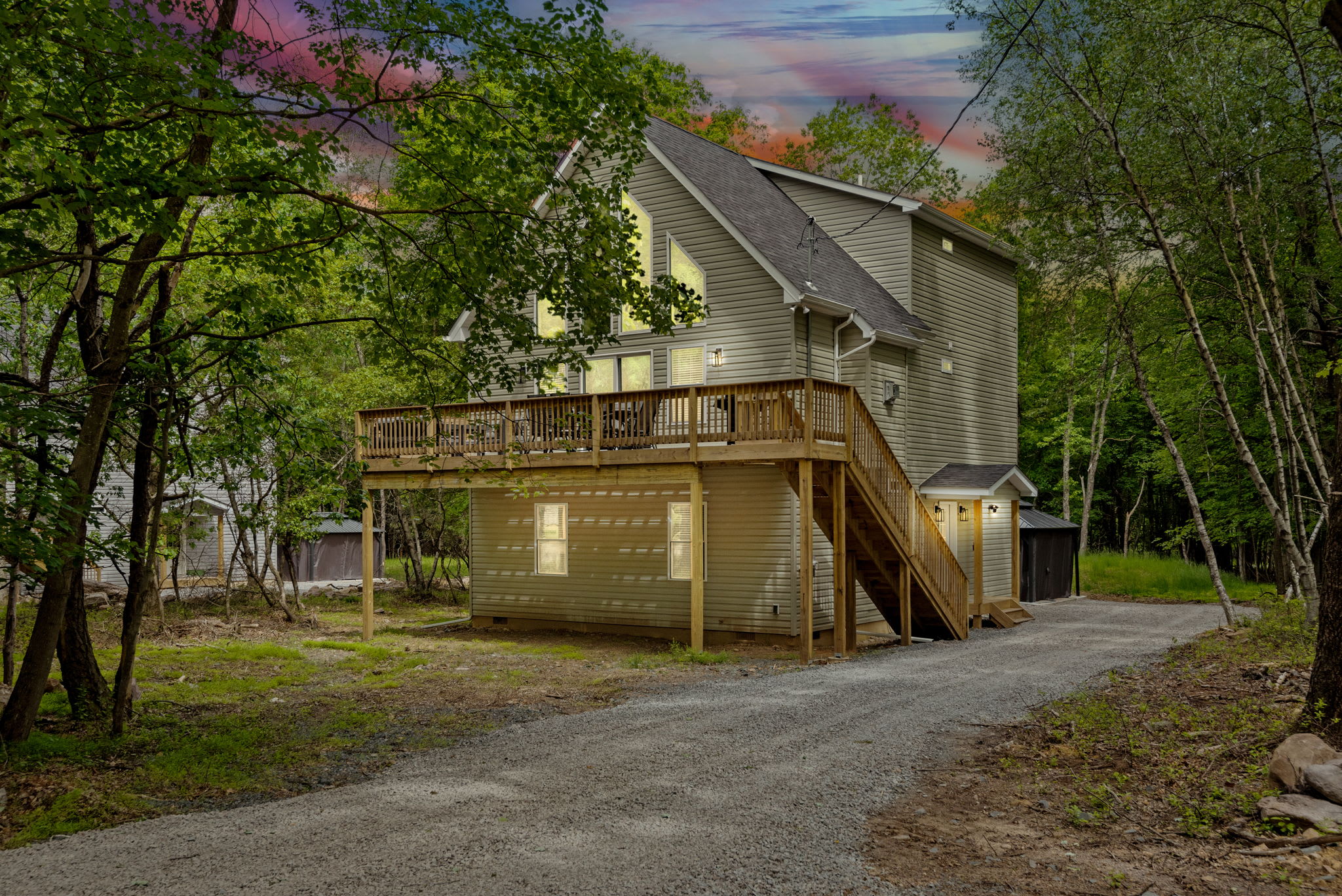 Front Exterior at Dusk
This charming retreat glows warmly in the evening, welcoming you home after a day of adventure or relaxation.