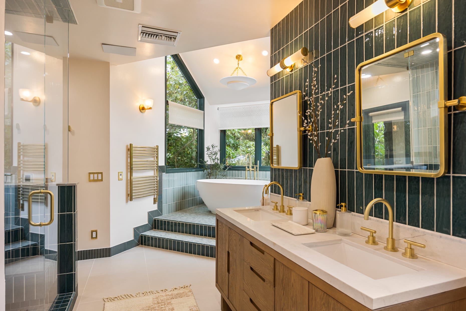 Elegant double vanity and spacious shower in the completely renovated master bath.