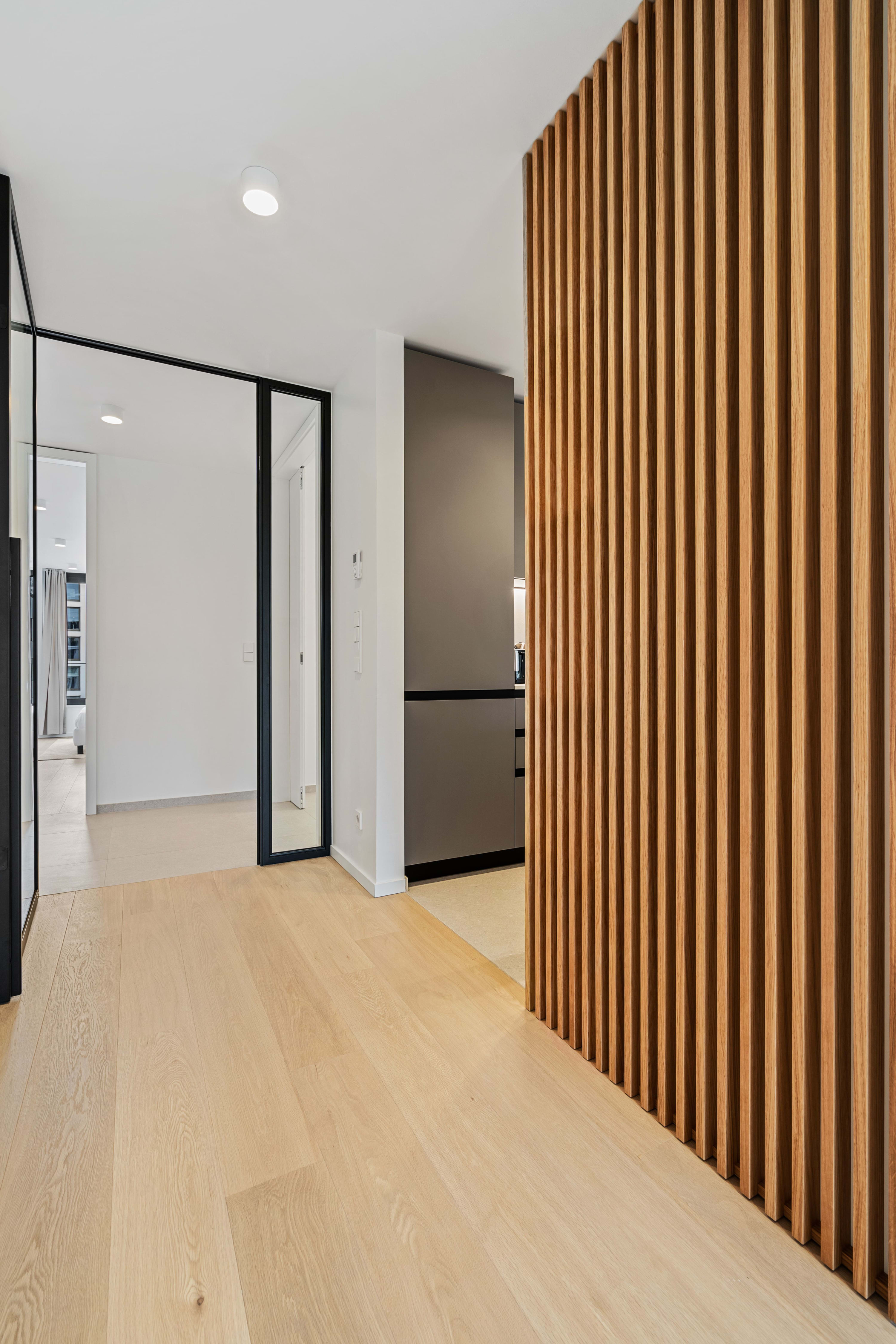 Architectural elegance with a touch of warmth in our hallway design.