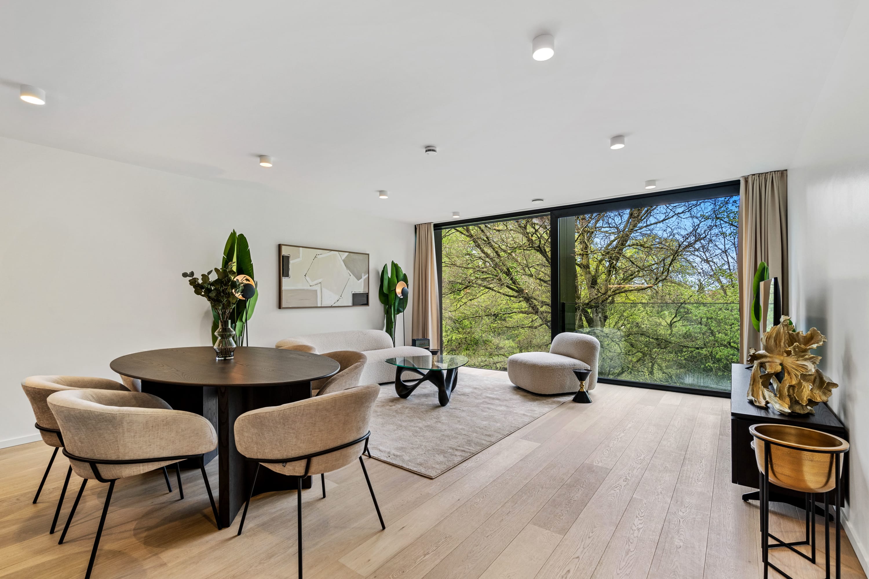 Relax in our spacious living area, where modern elegance meets natural light.