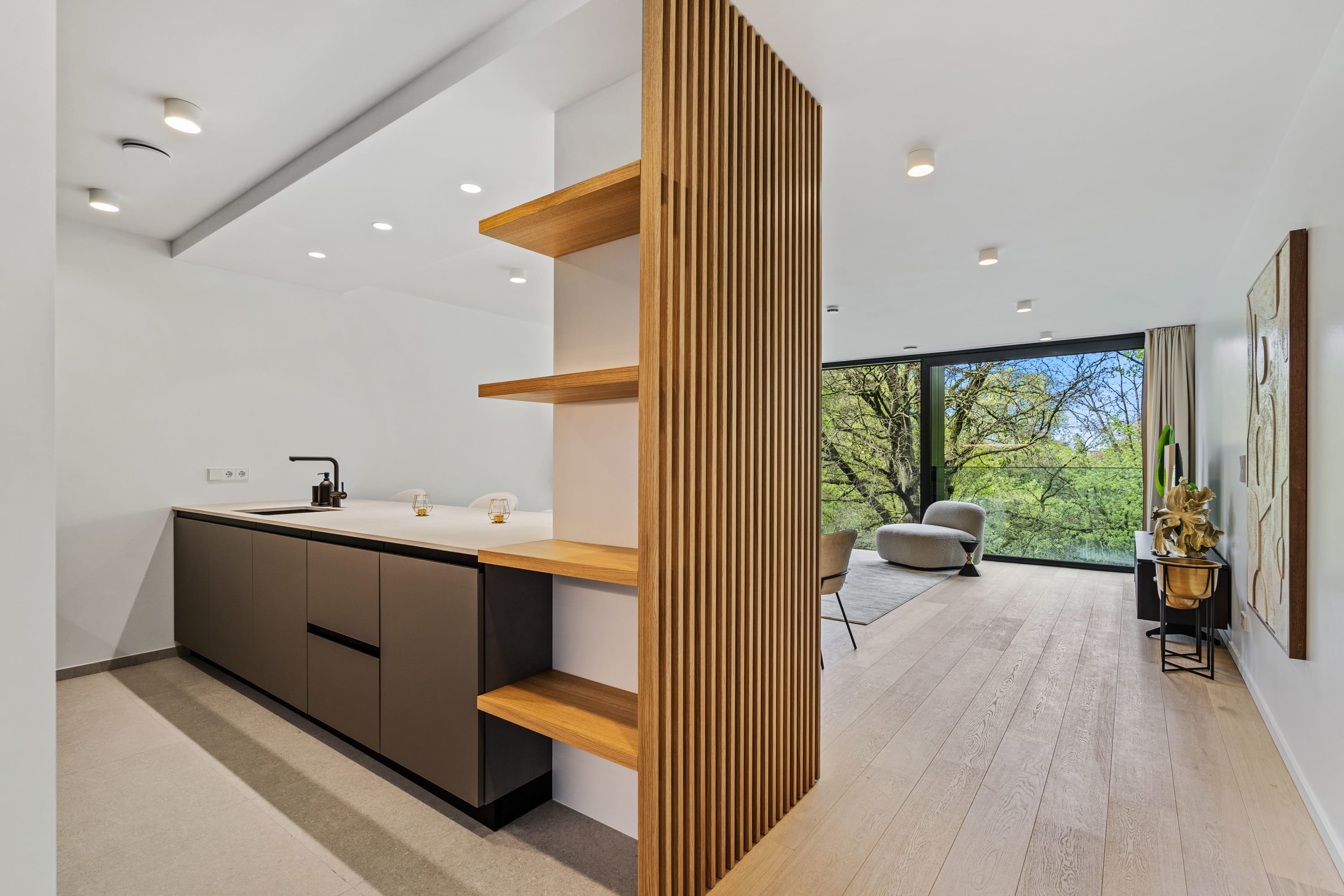 Our open-plan design seamlessly connects cooking and living spaces for your comfort.