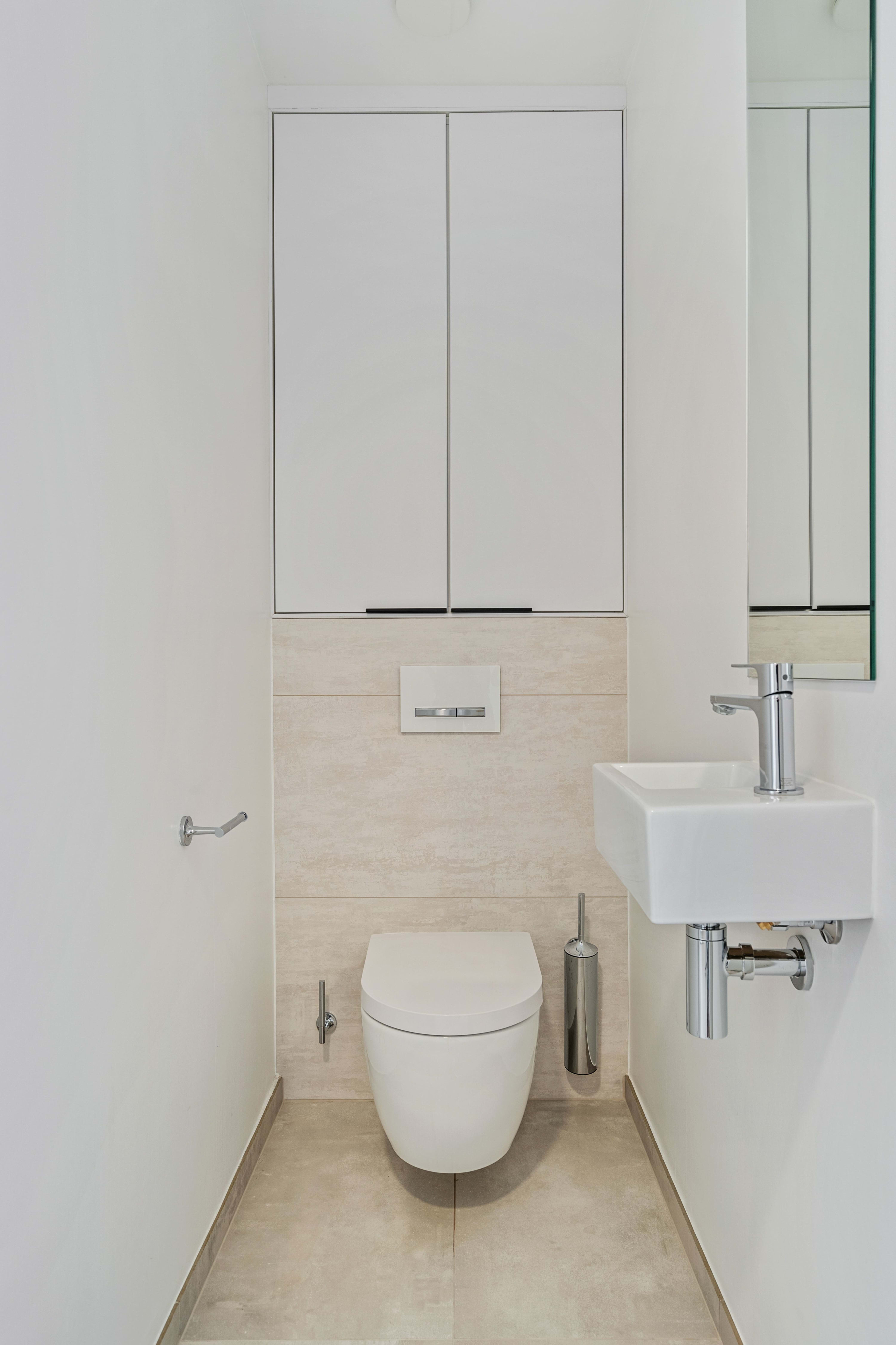Simplicity redefined in our sleek, compact guest restroom.