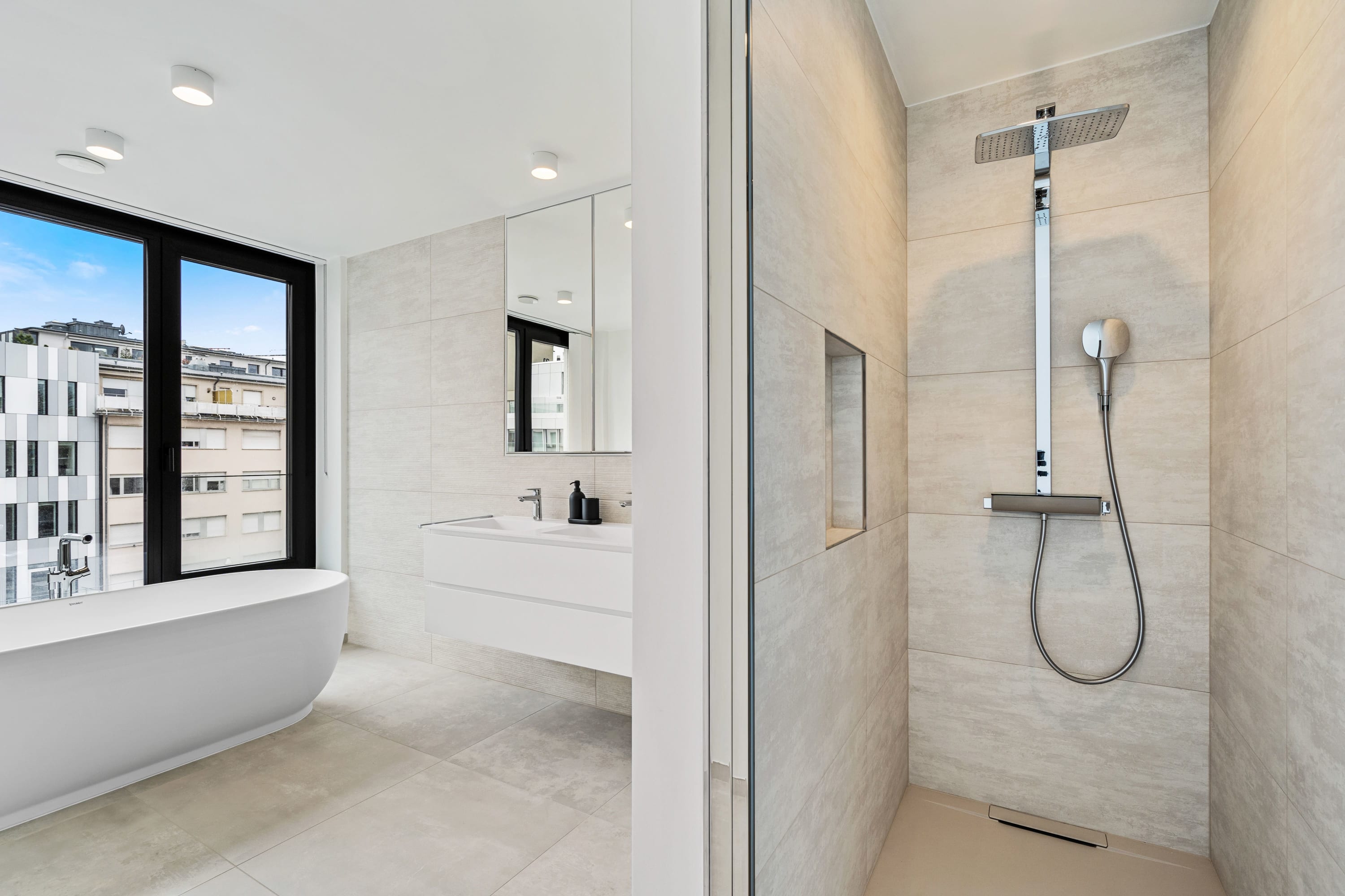 Soak up the views in a bath that blends urban vistas with spa-like tranquility.