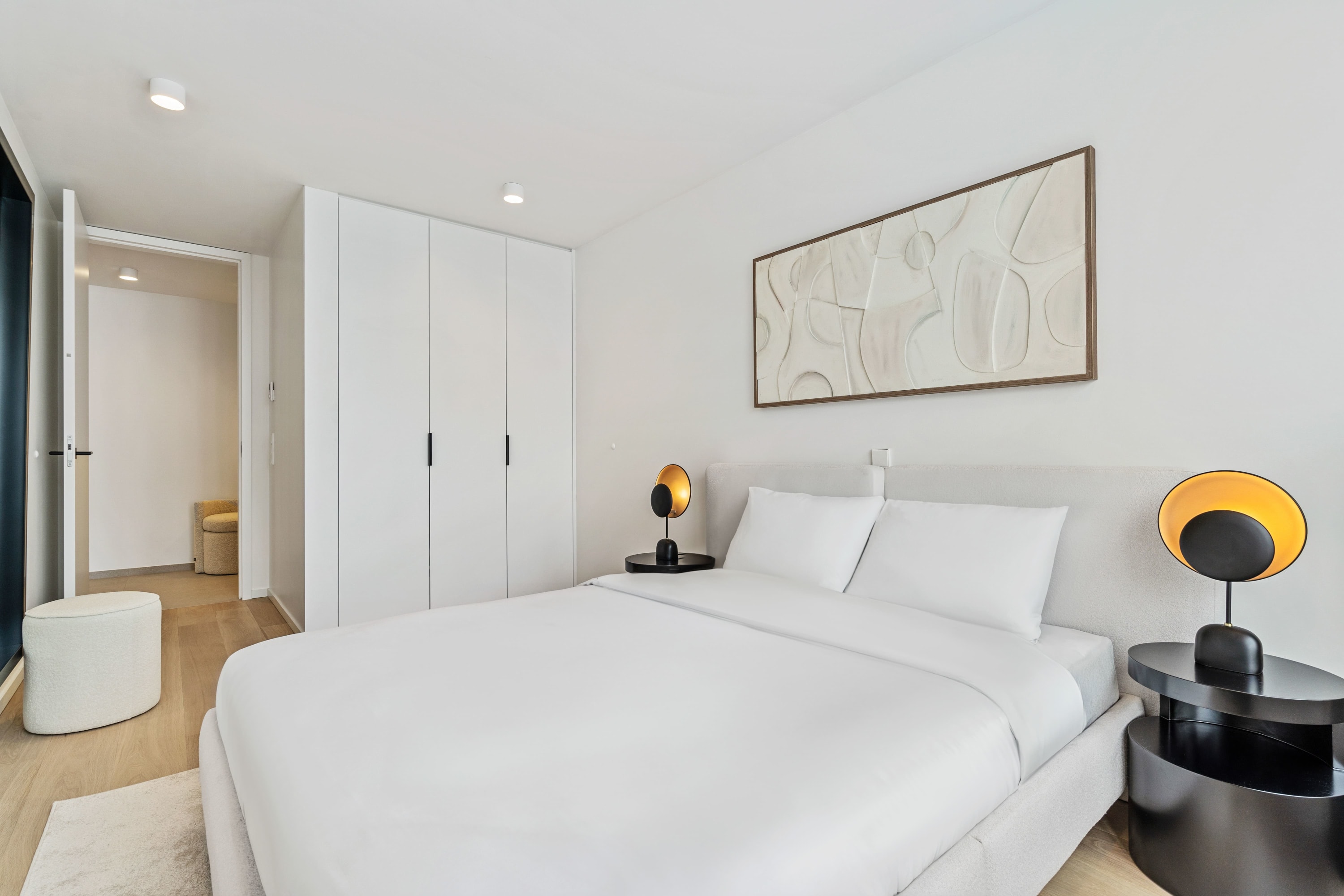 Sophisticated simplicity: our bedroom is your haven of peace with en suite access.