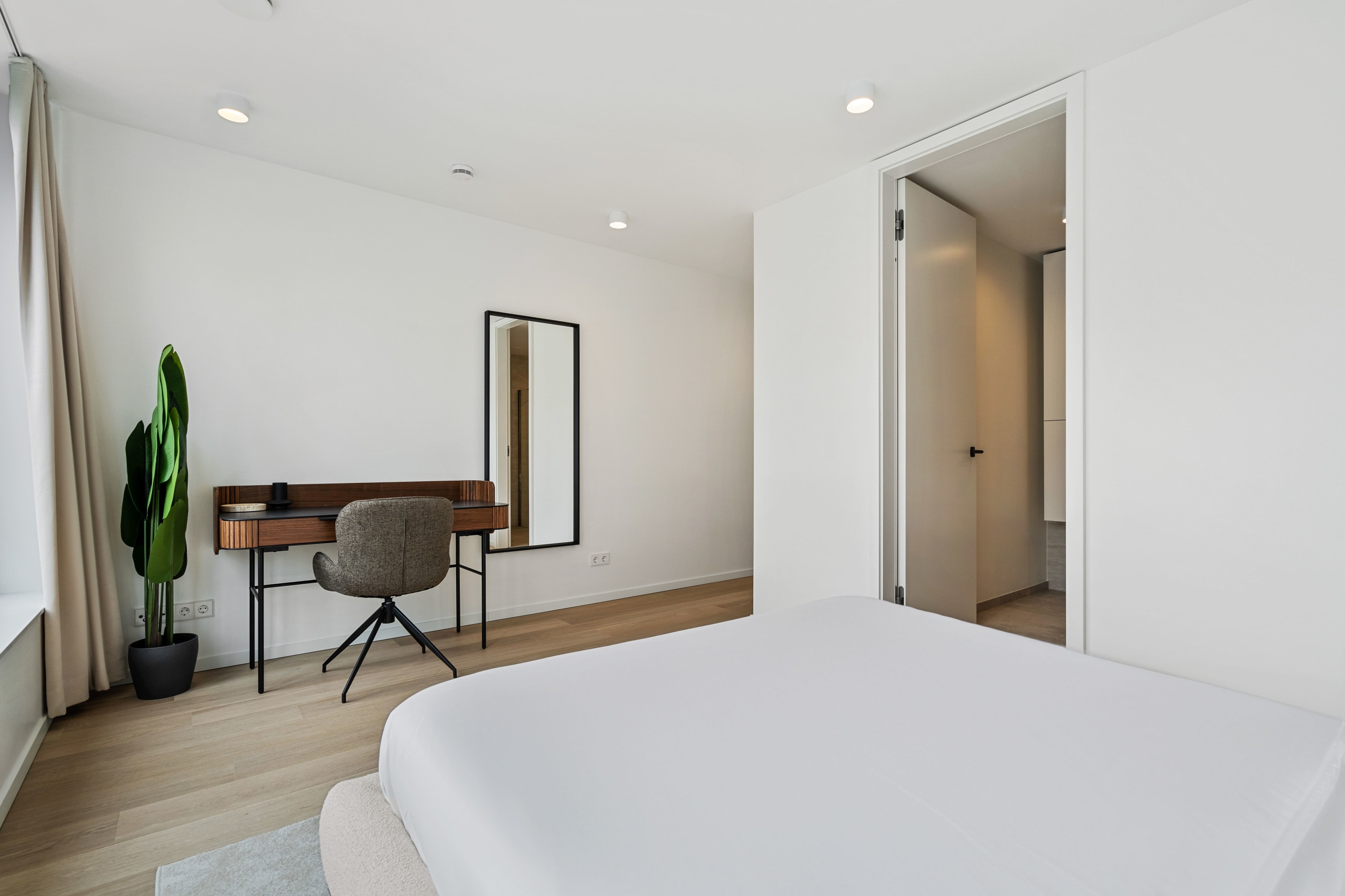 Slumber in style with the chic comfort of our minimalist bedroom design.