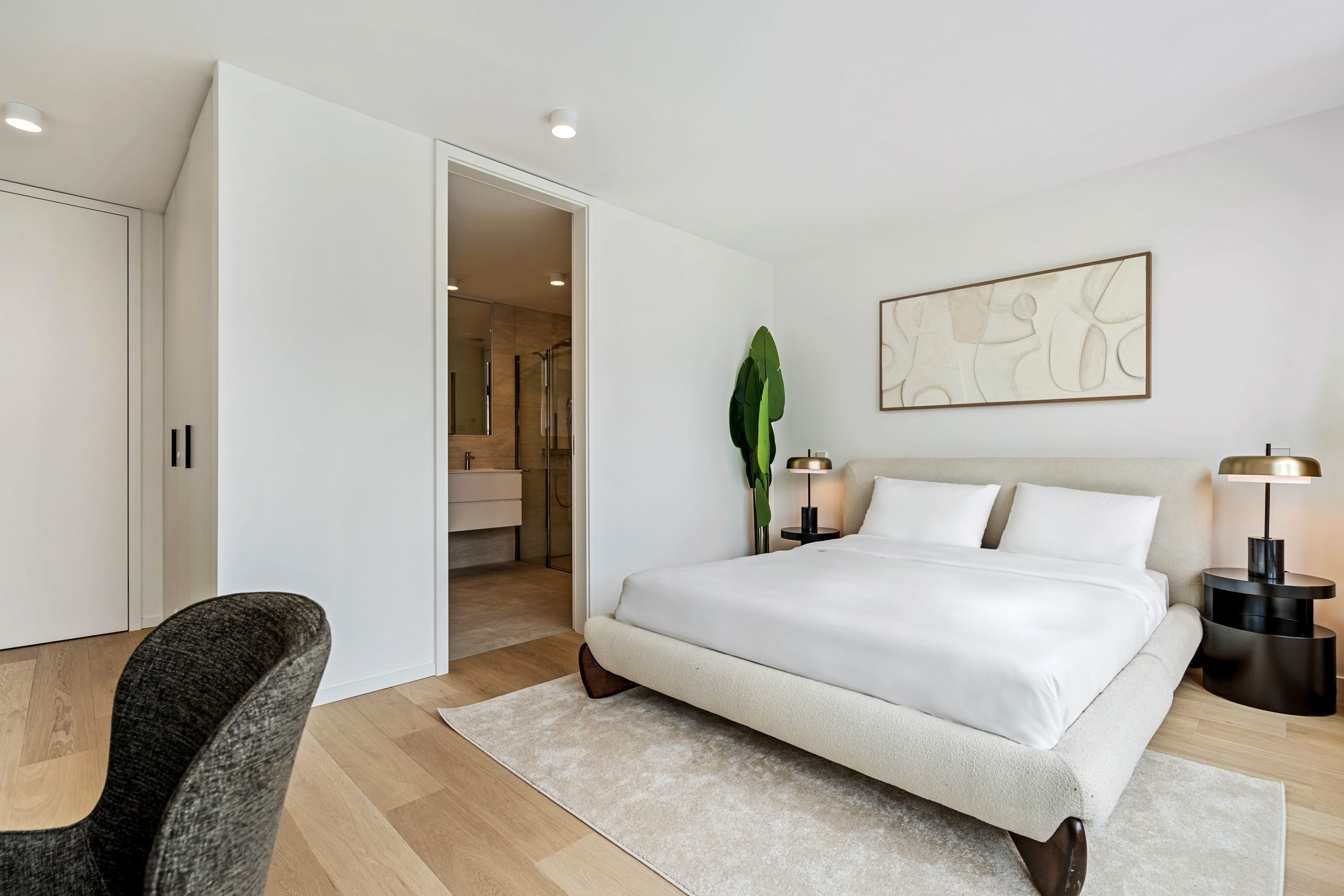 Dream easy in our chic bedroom with panoramic windows that bring the city to you.