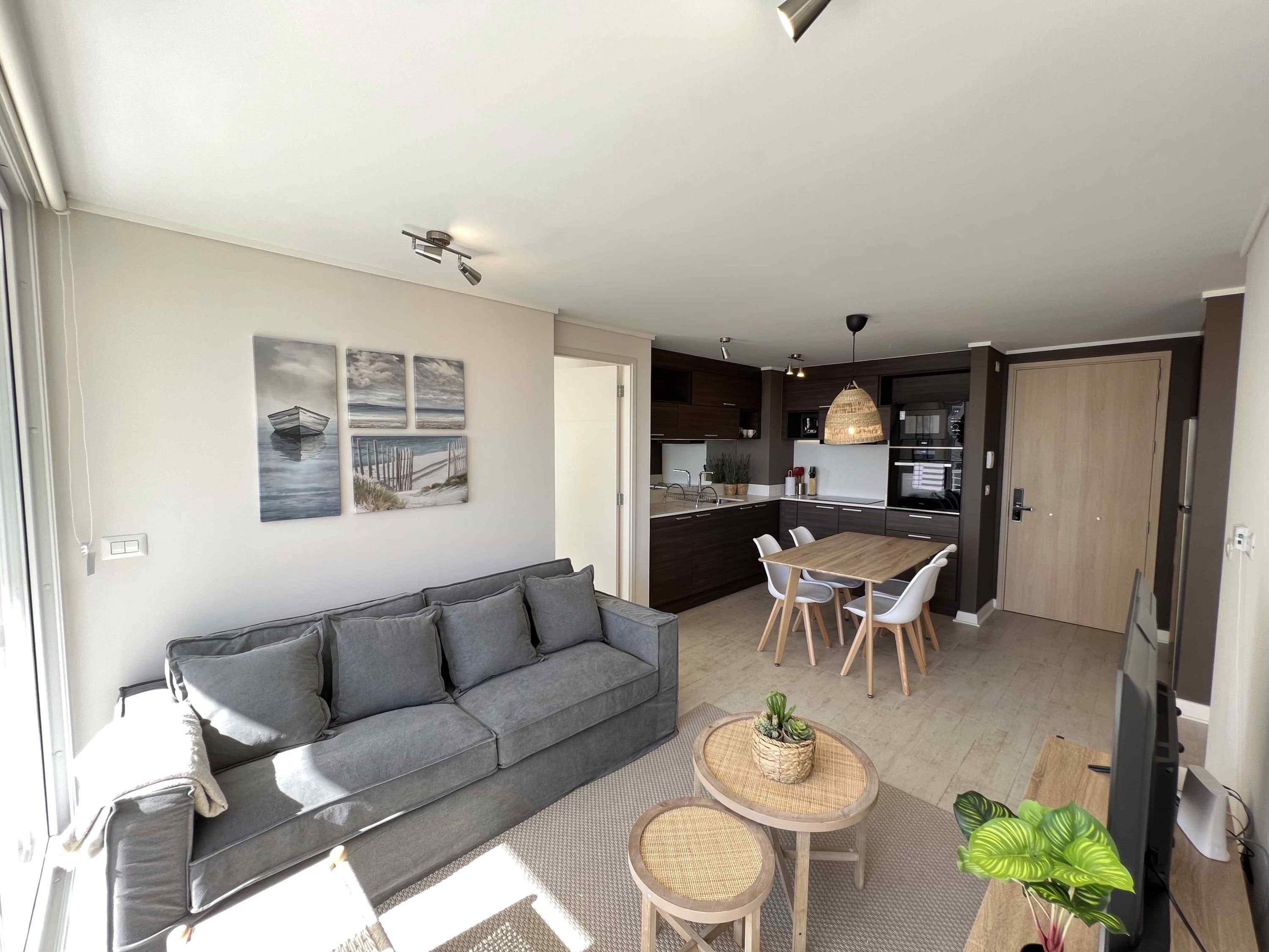 Cozy and bright living space with a modern kitchen and dining area, perfect for relaxing after a day of exploring.