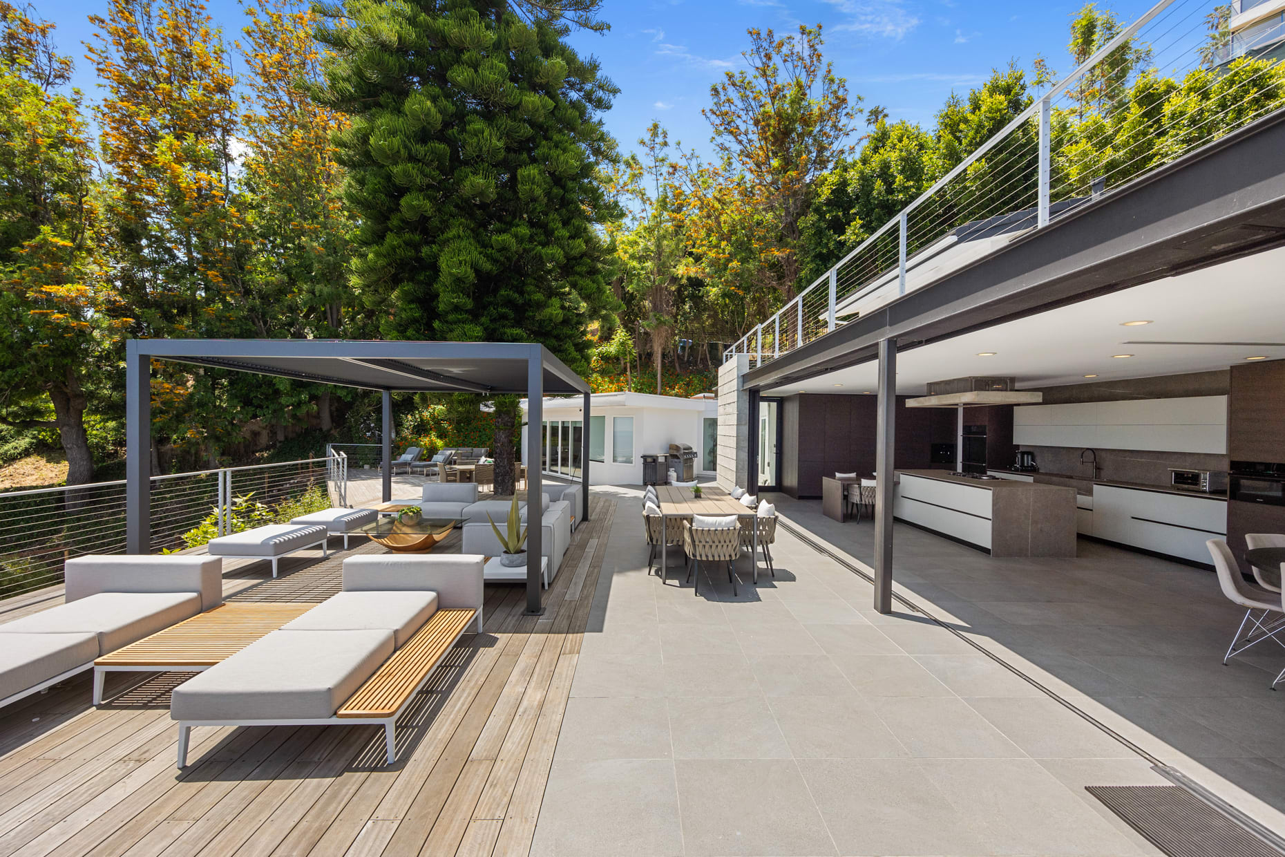 Perfect for outdoor living with alfresco dining areas, sunbathing spots, and an outdoor kitchen.