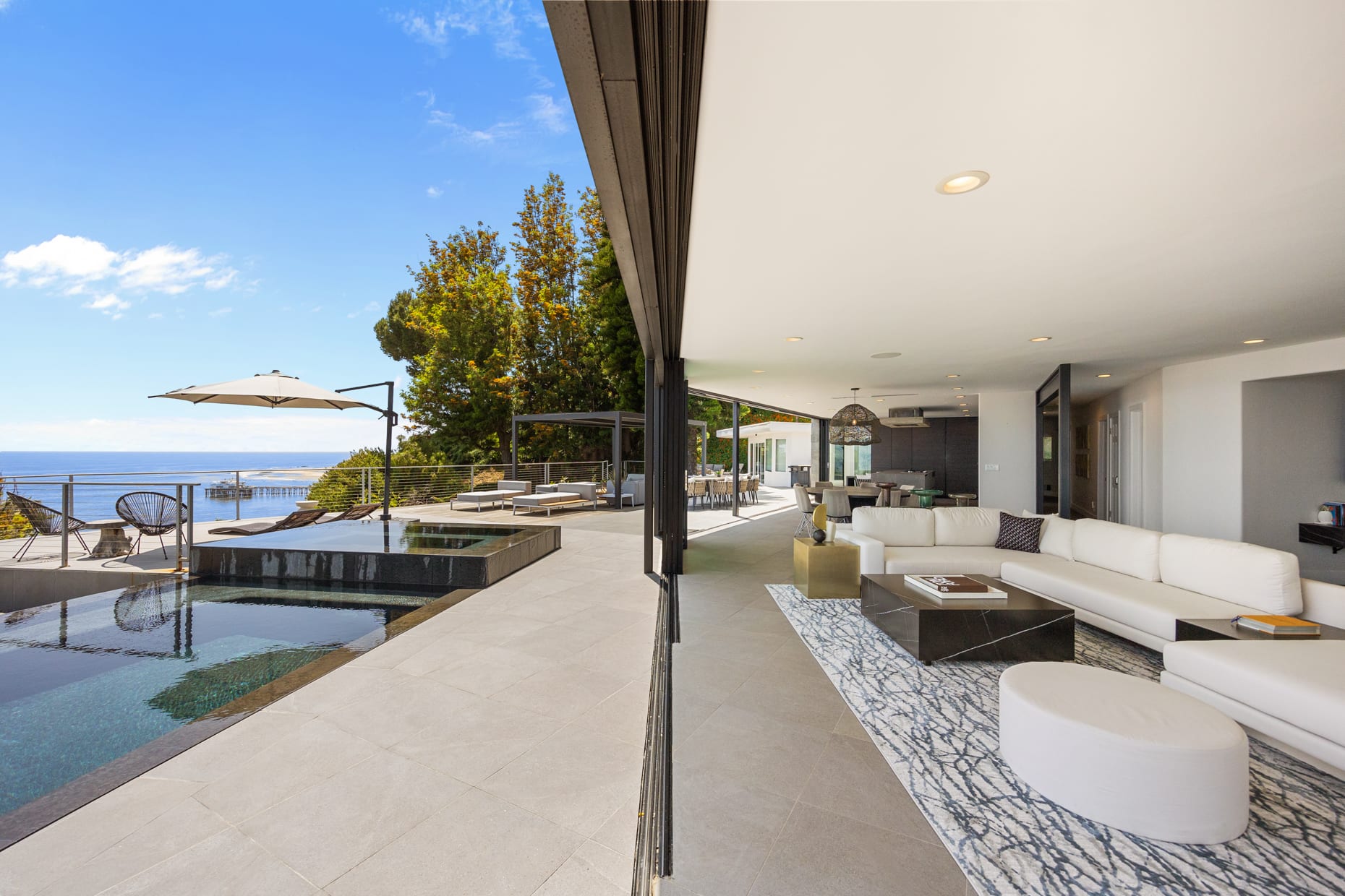 Experience seamless indoor-outdoor living as the living room opens directly onto the expansive patio.