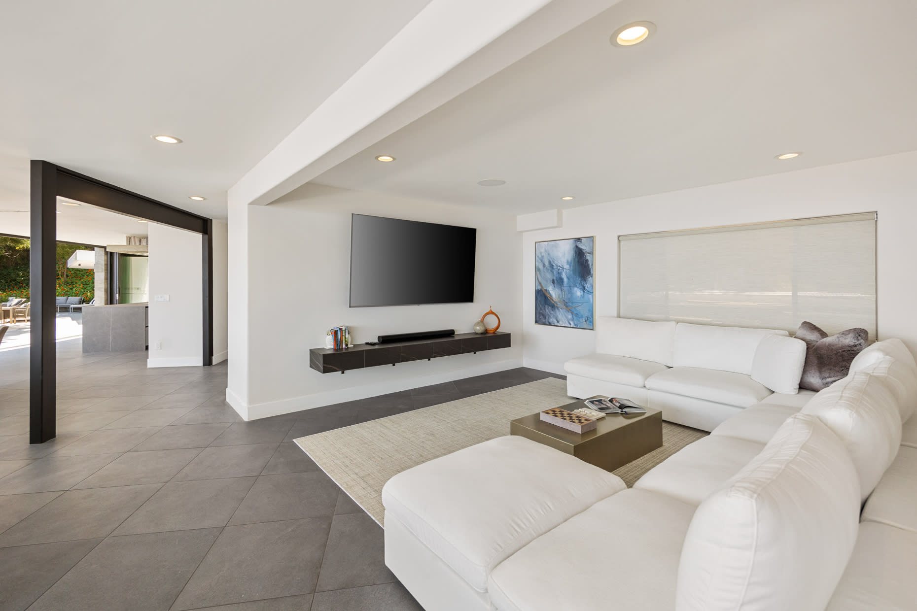 Natural light floods the room, illuminating the coastal-inspired décor.