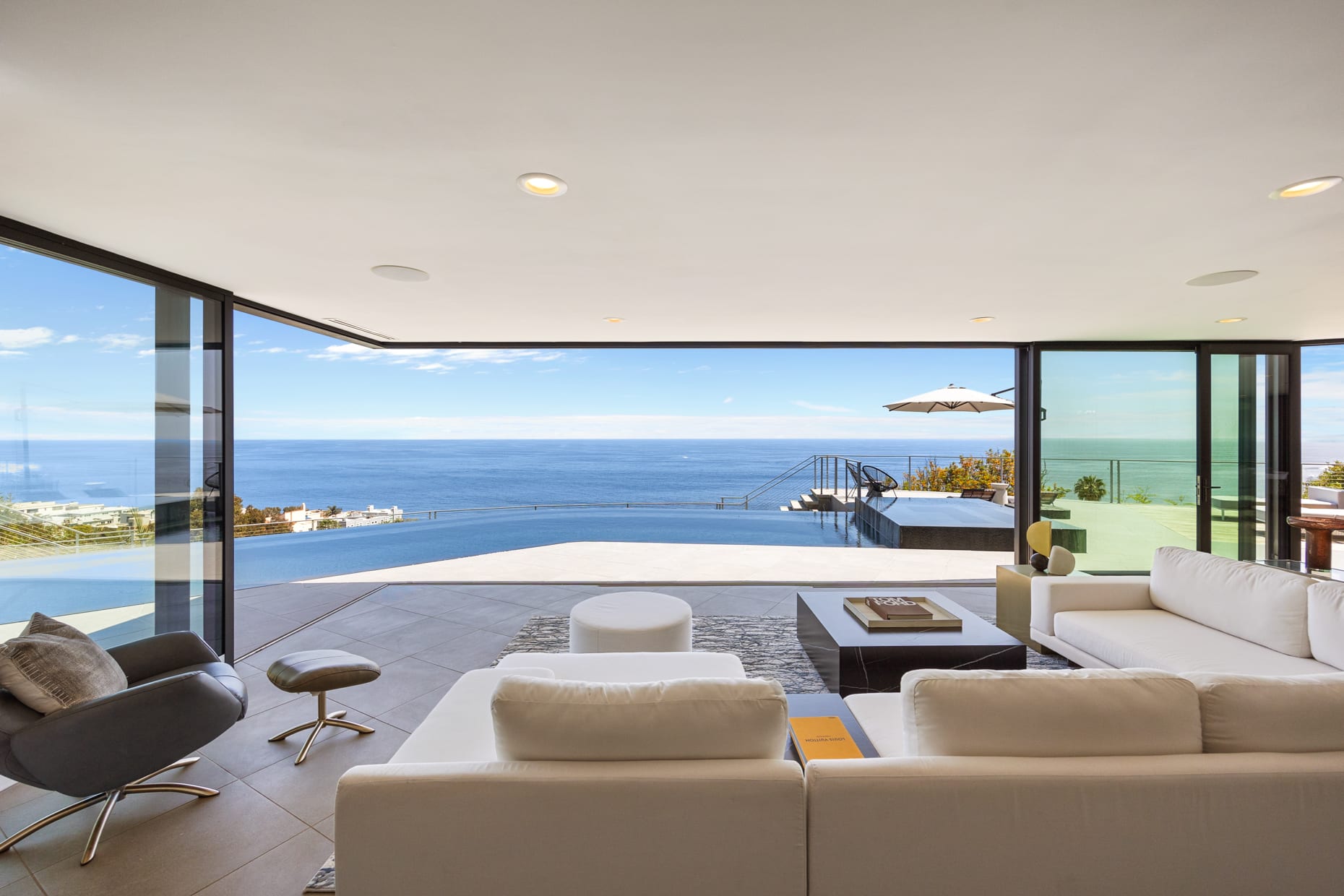 The living room seamlessly blends indoor comfort with the awe-inspiring outdoor beauty.