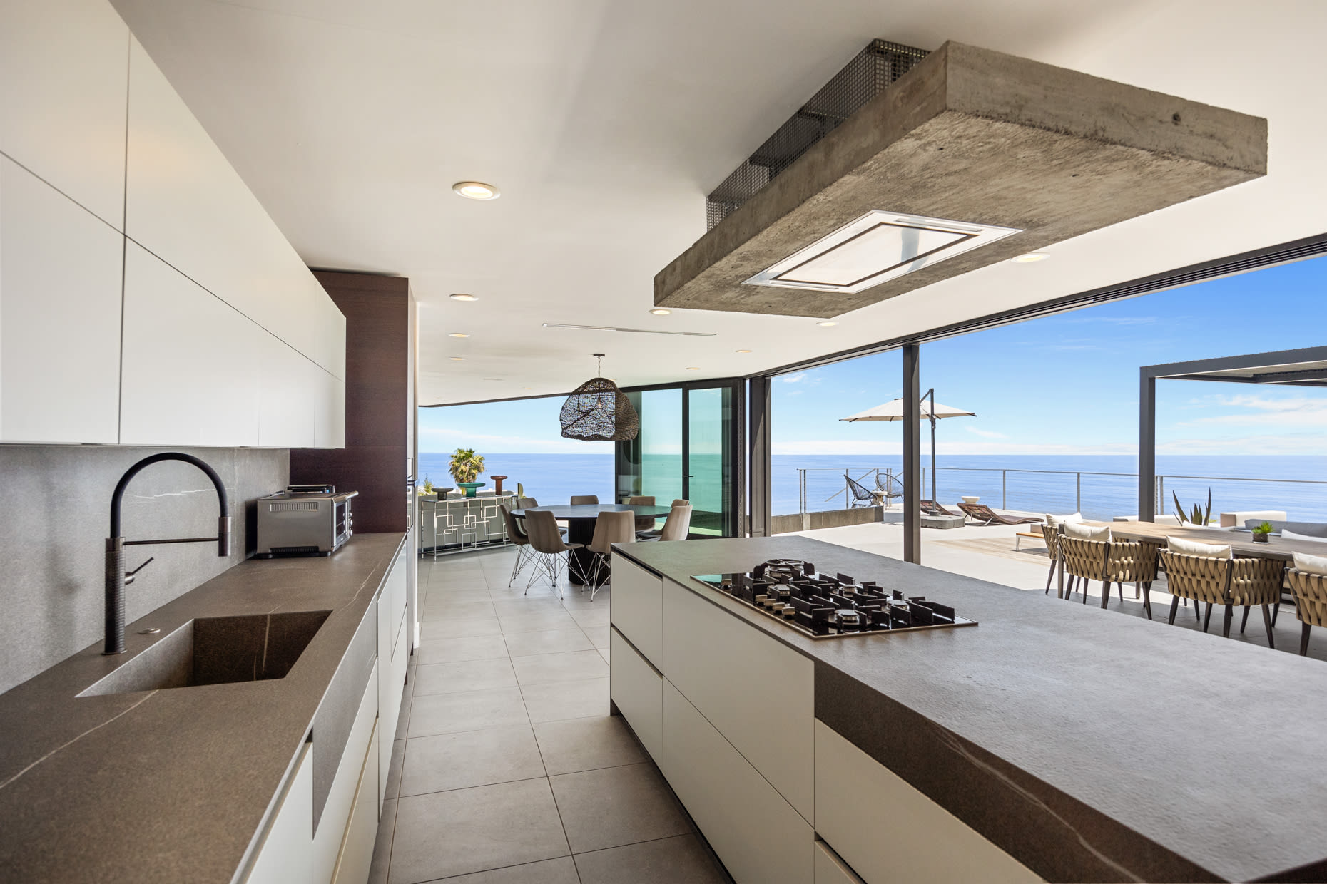 The kitchen is a chef's dream, equipped with state-of-the-art Miele appliances and a spacious island for culinary creativity.