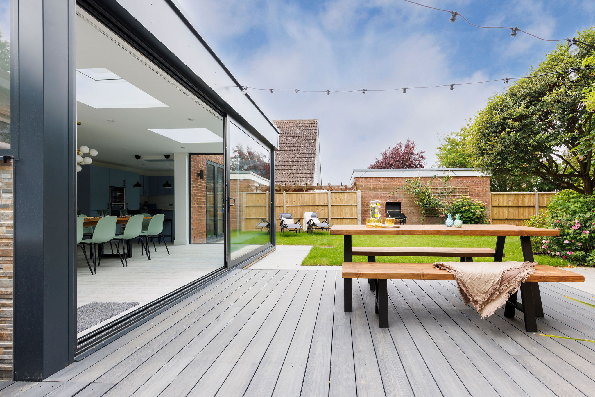Serene backyard with hot tub and dining area