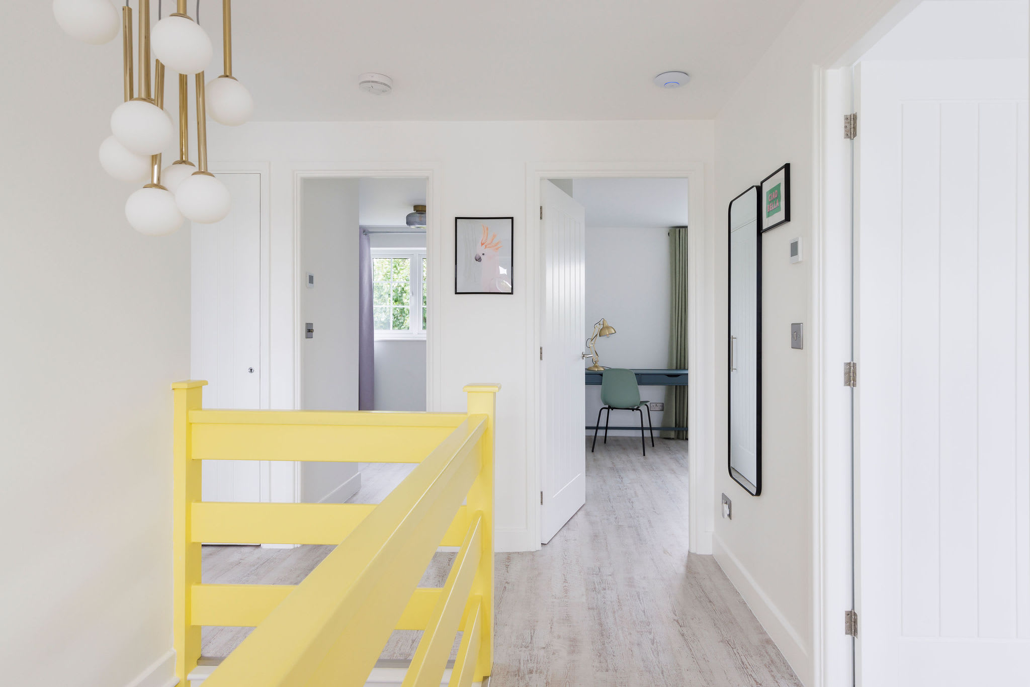 Bright hallway leading to the master bedroom with modern decor