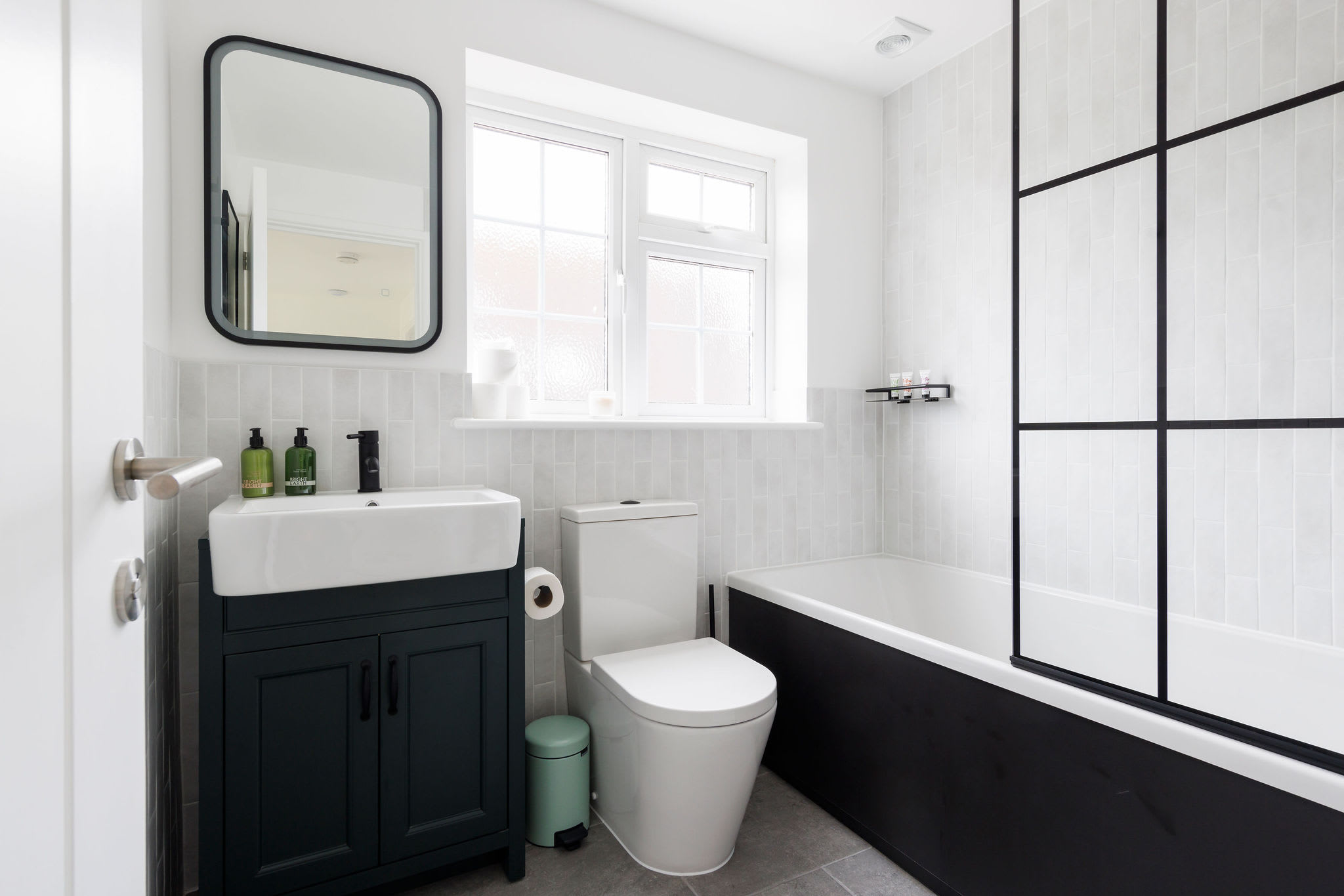 Sleek bathroom design with modern fixtures, a bathtub, and a spacious layout