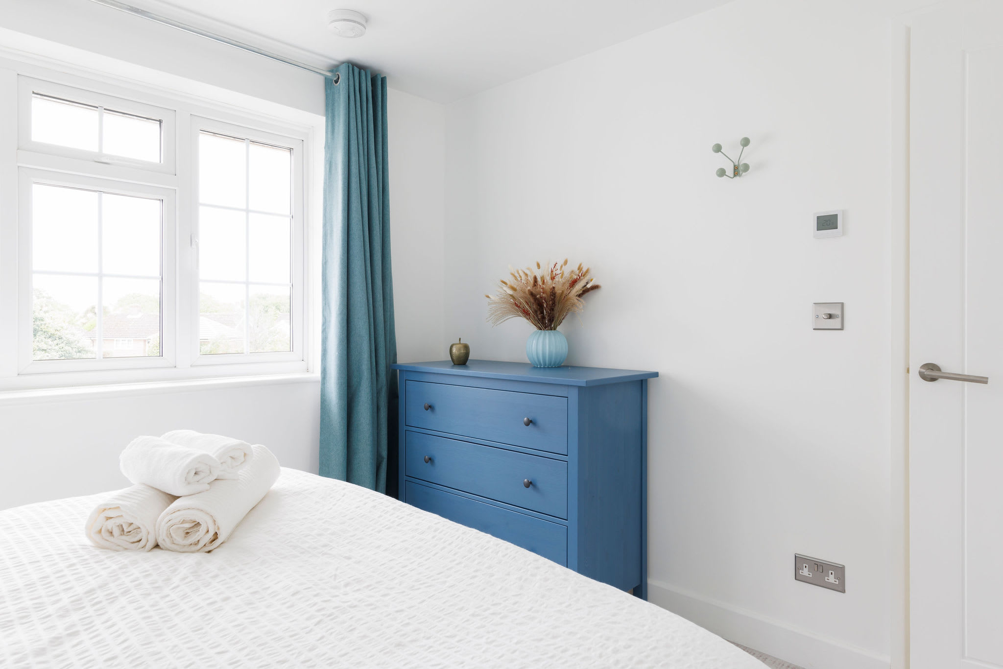Bright bedroom with ample storage space and minimalist decor