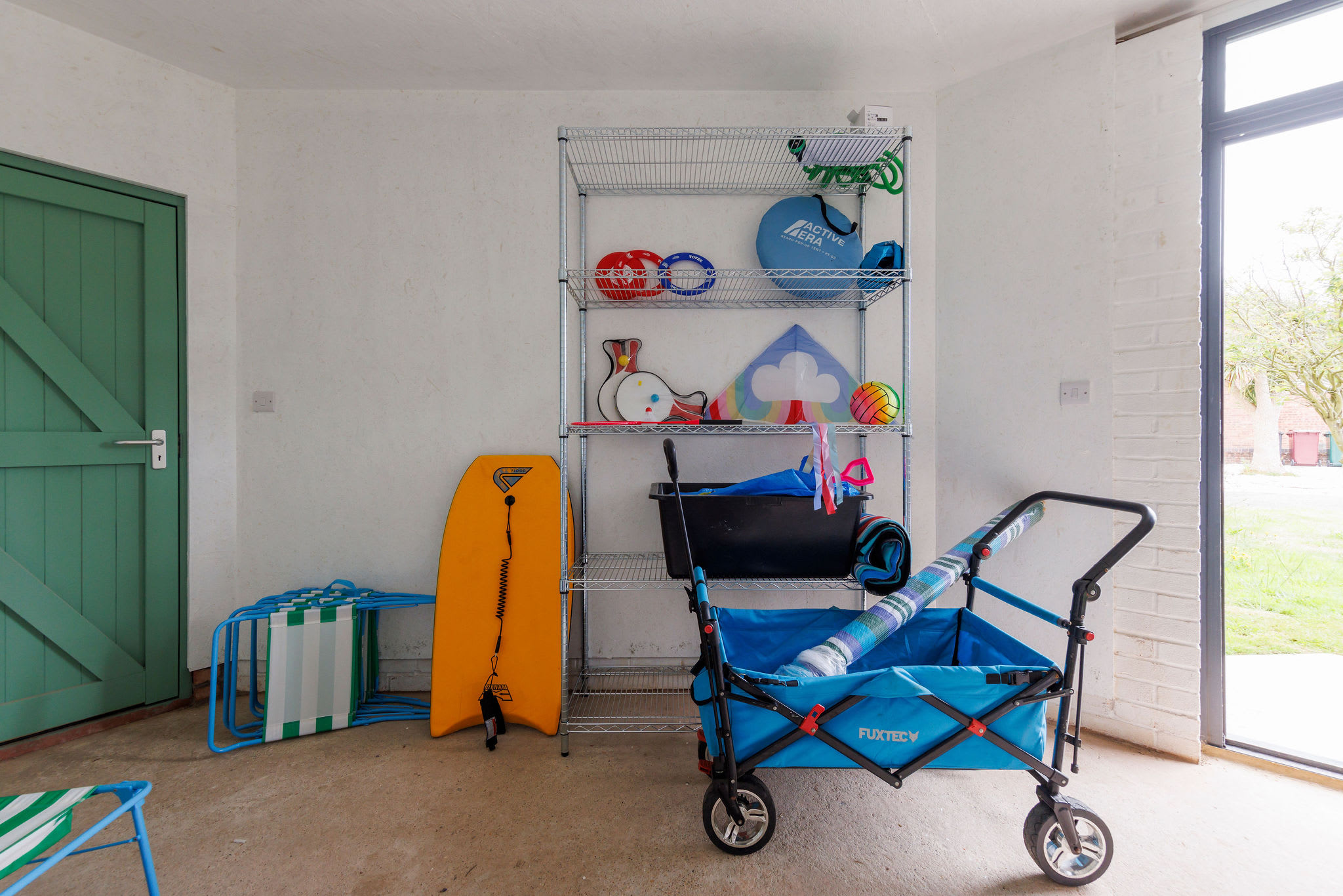Organised storage area with beach gear, ready for fun outings