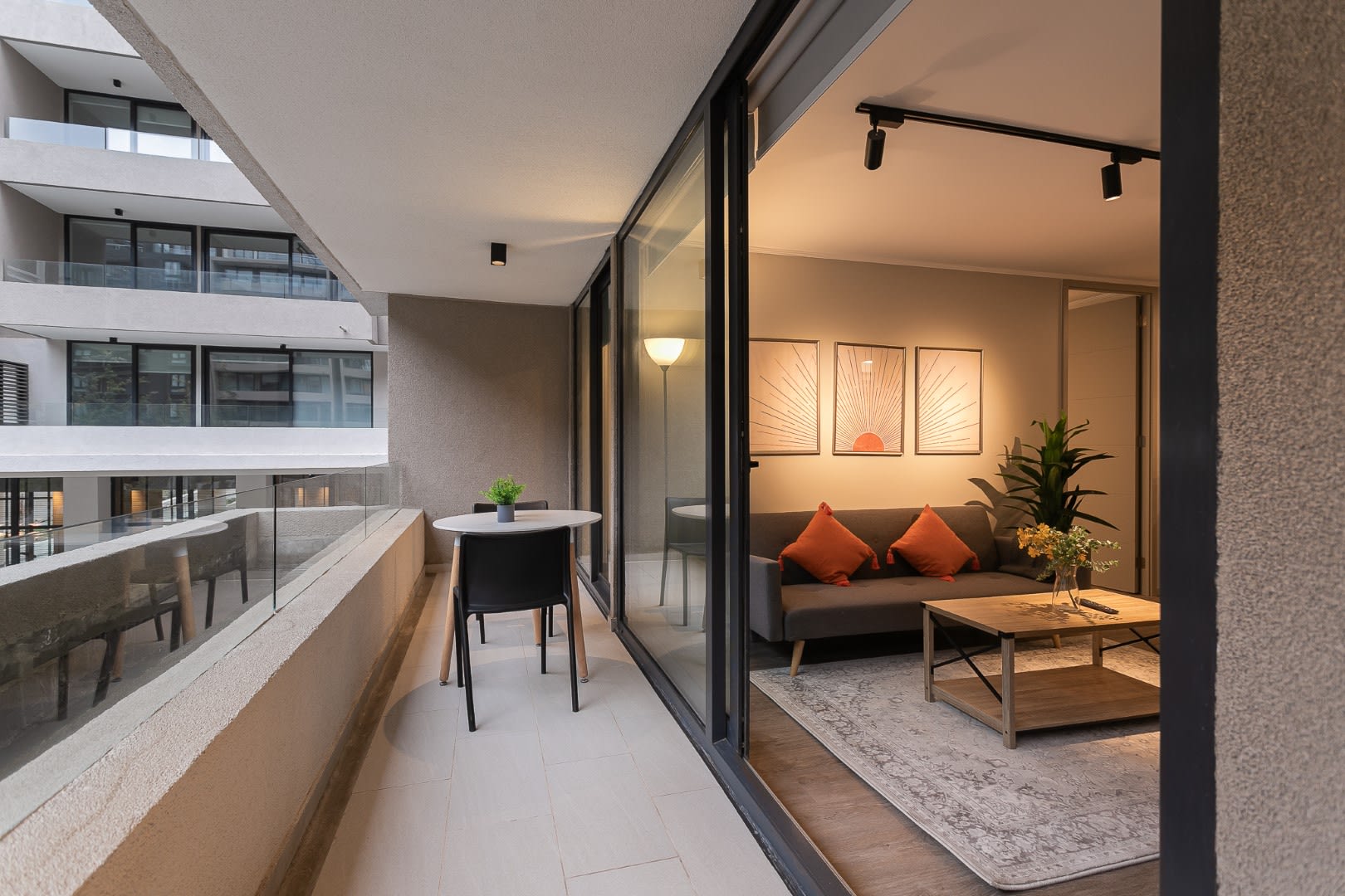 Relax on the stylish balcony or unwind in the cozy living room, perfect for a serene getaway.