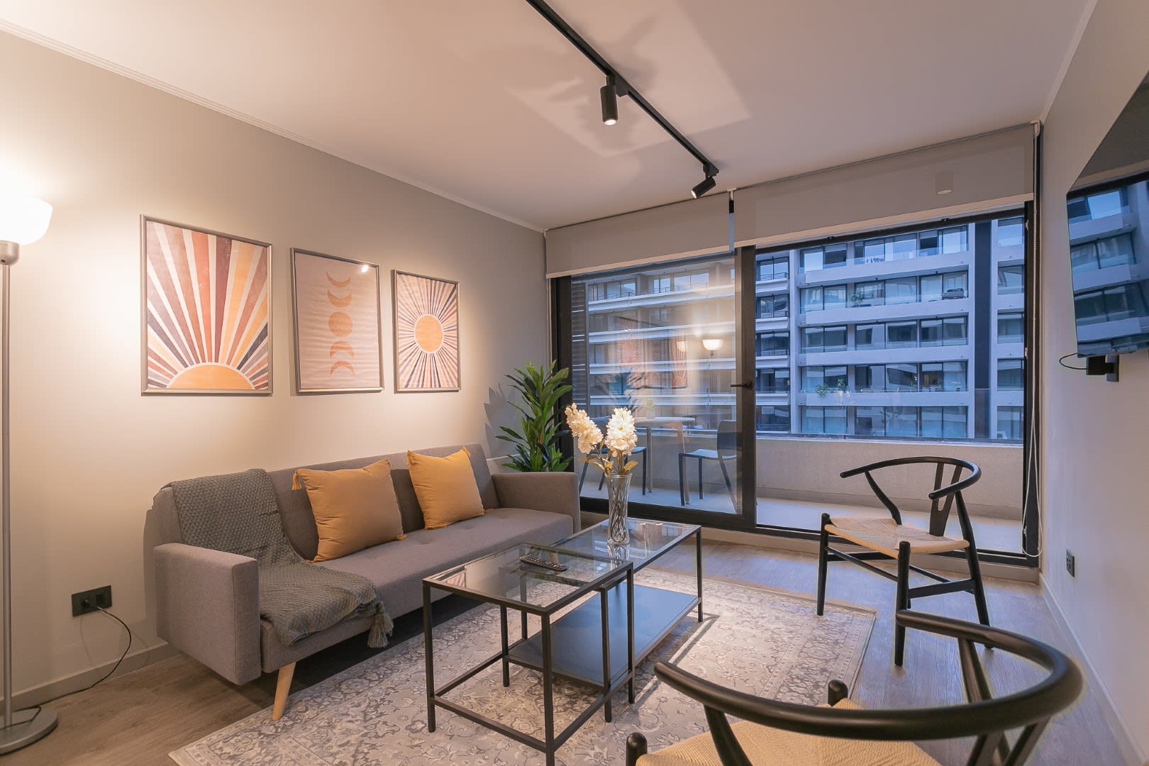 Relax in this stylish living room with city views, modern decor, and cozy seating—perfect for unwinding after a day of exploring.
