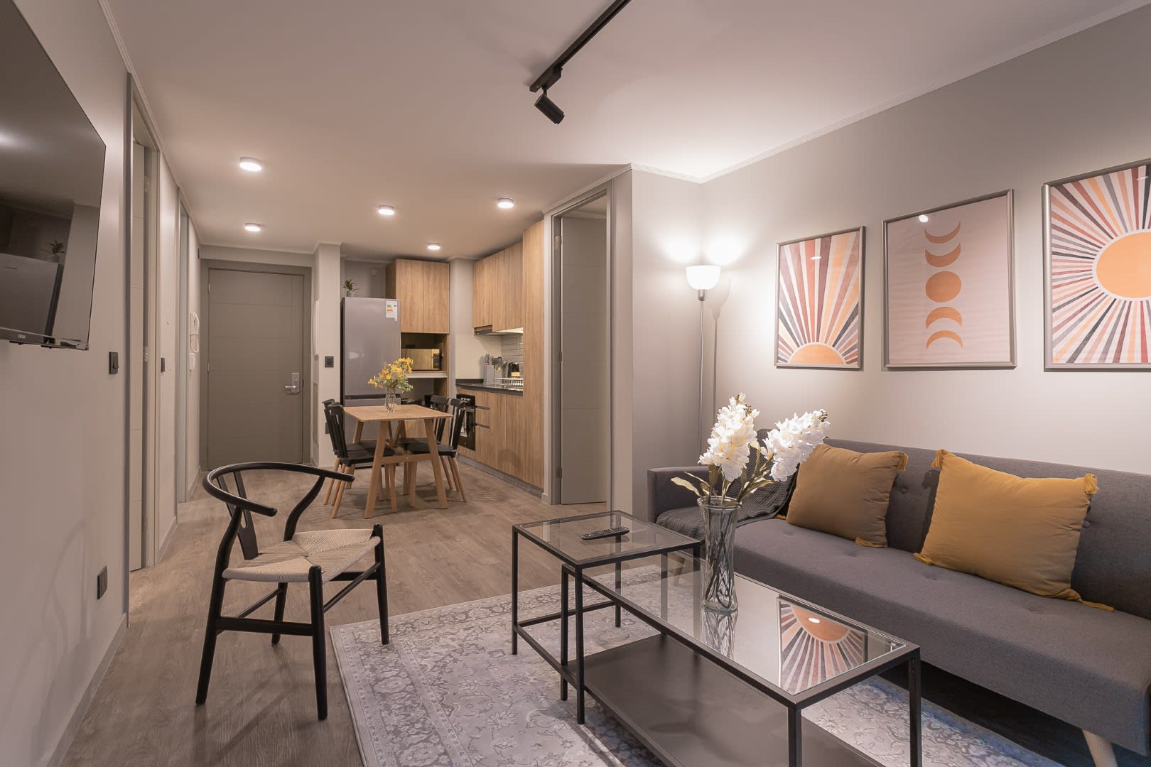 Chic and cozy living space with modern decor and warm lighting, perfect for relaxing after a day of exploring.